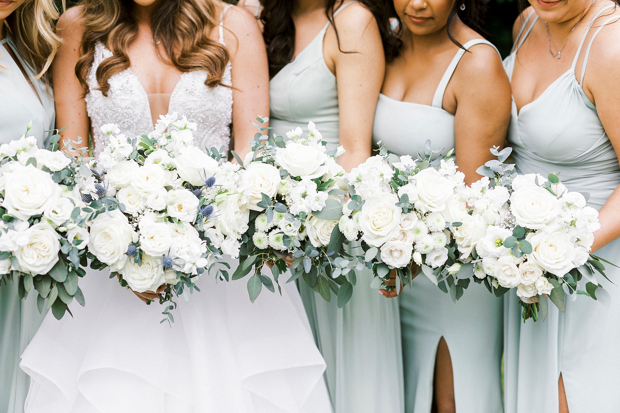 all-white bouquets for bride and bridesmaids for spring Separk Mansion wedding day