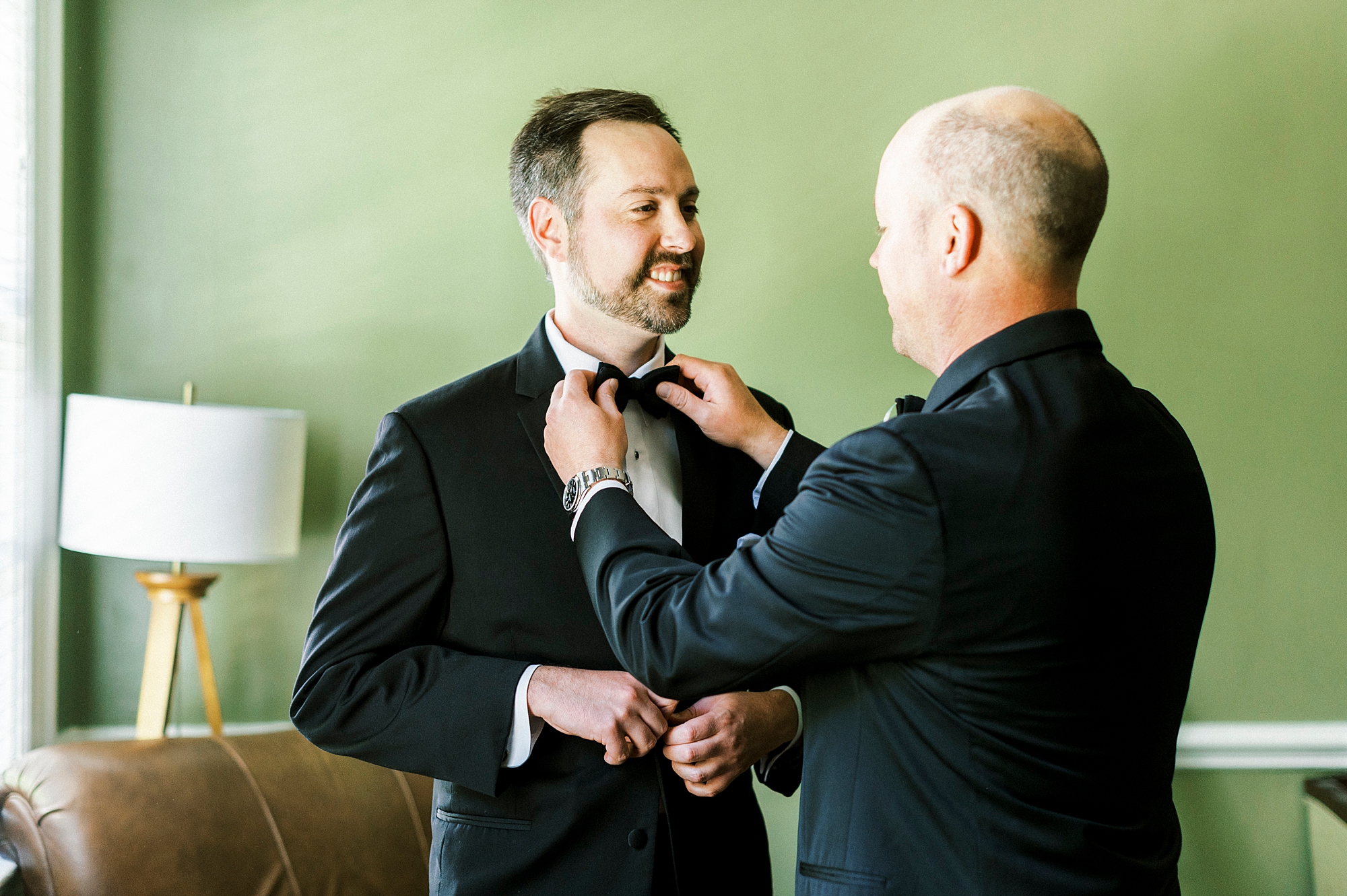 dad helps son with tie on wedding day in NC