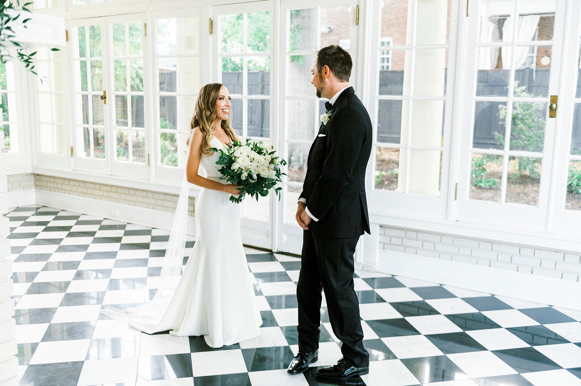 bride approaches groom for first look at Separk Mansion