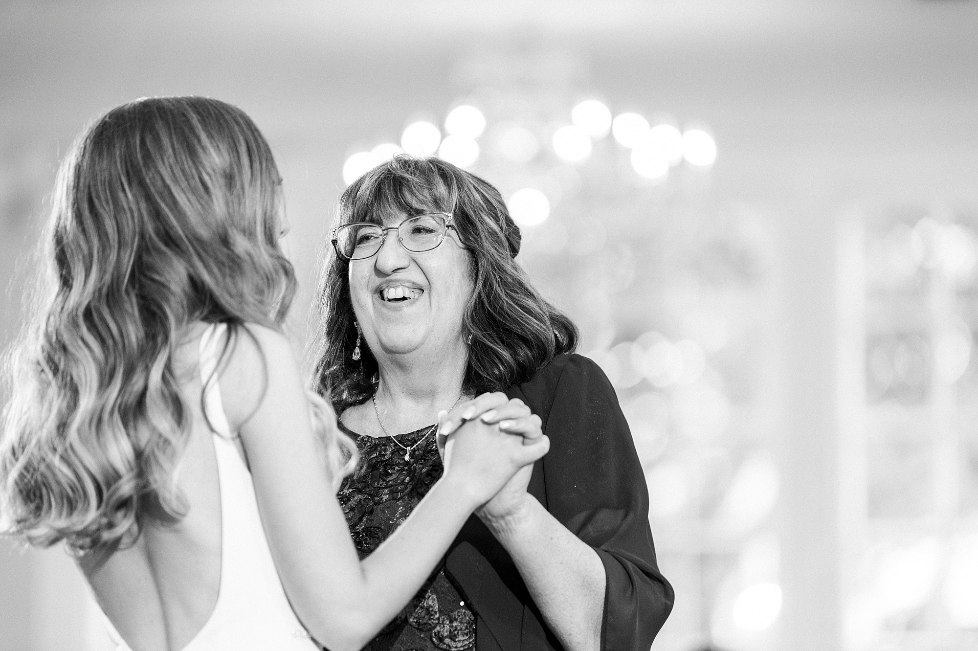 bride and mom dance during NC wedding reception