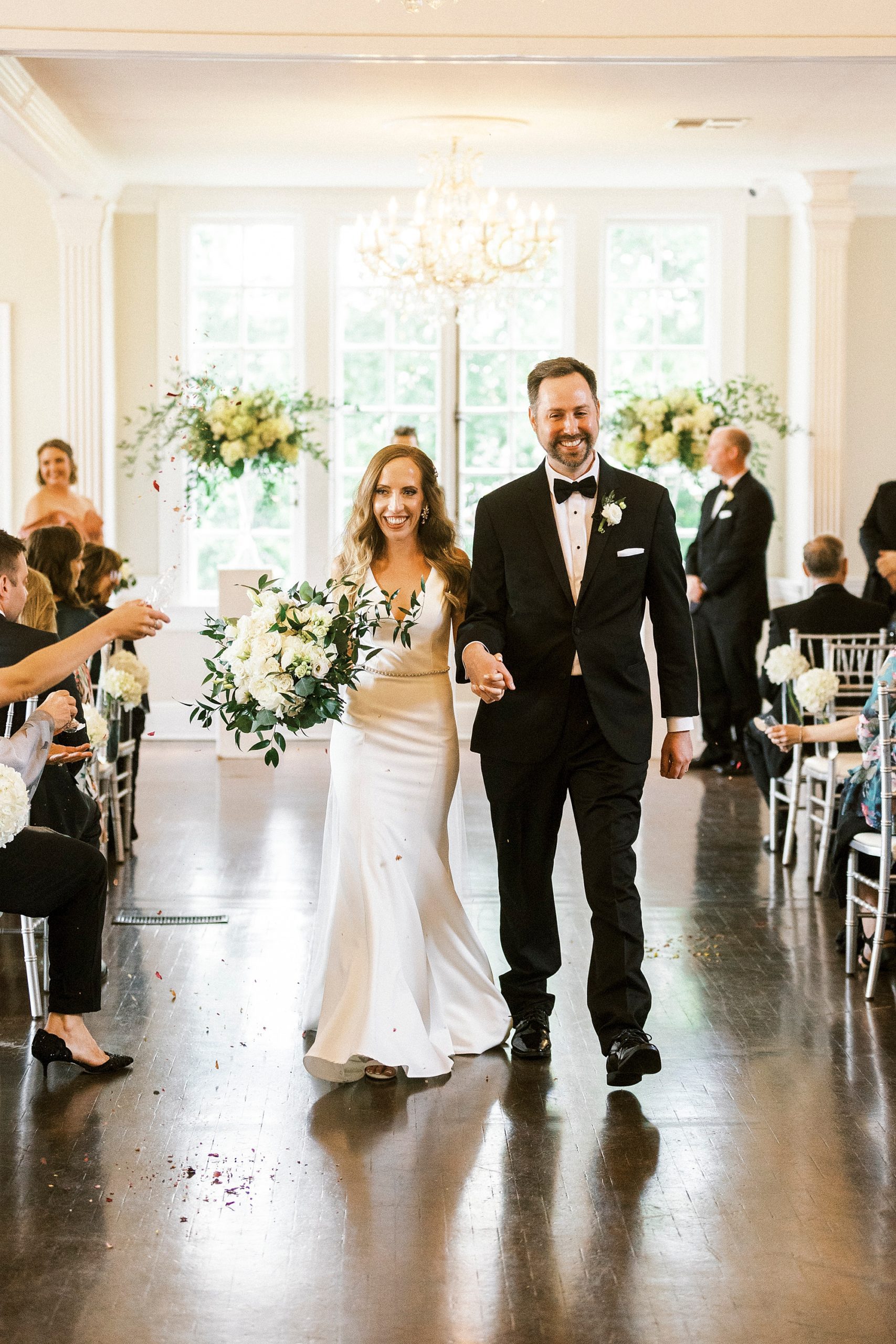 bride and groom walk up aisle at Separk Mansion