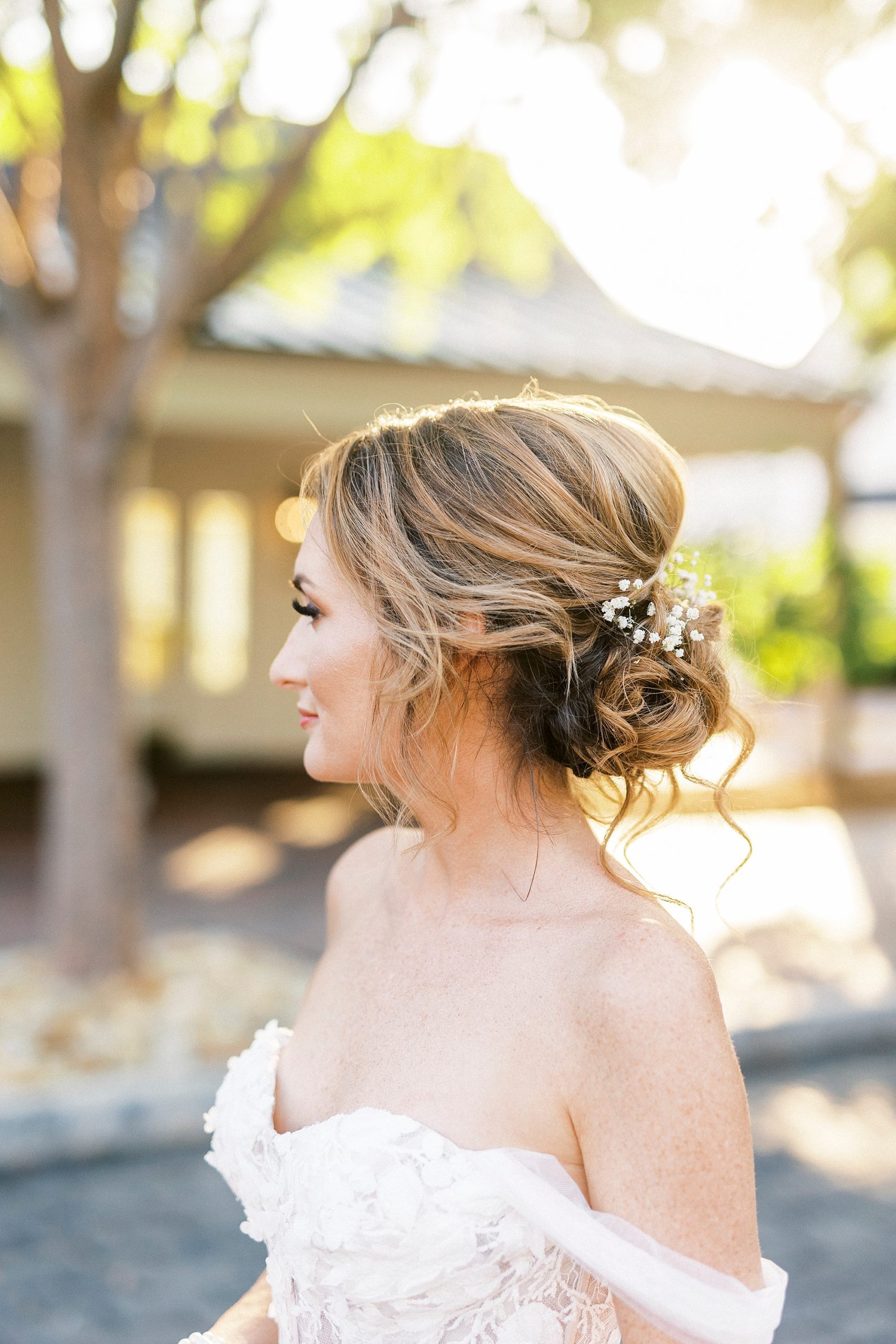 bride smiles with updo during sunset Trump National Golf Club bridal portraits