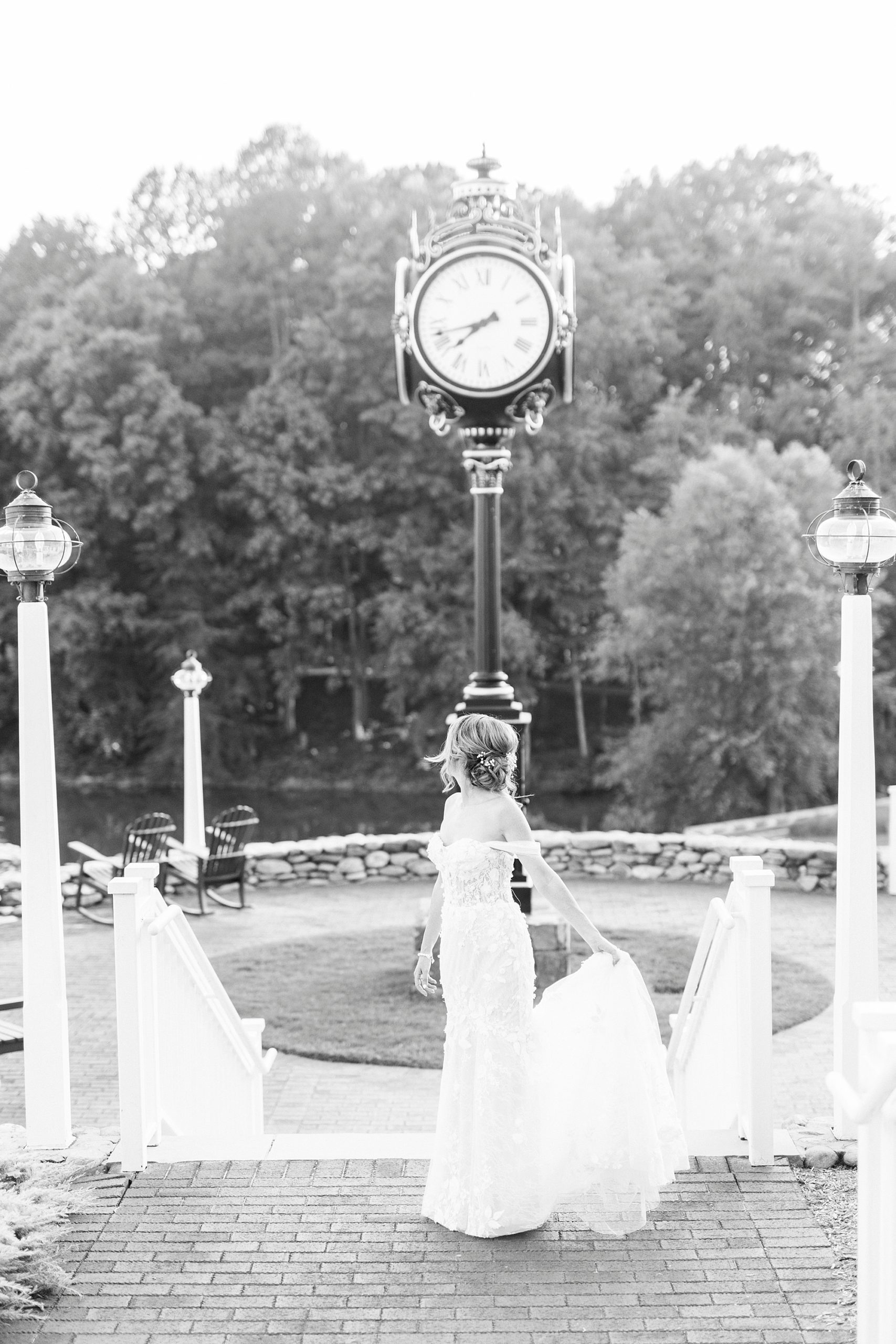 bride walks by clock on golf course during bridal session 