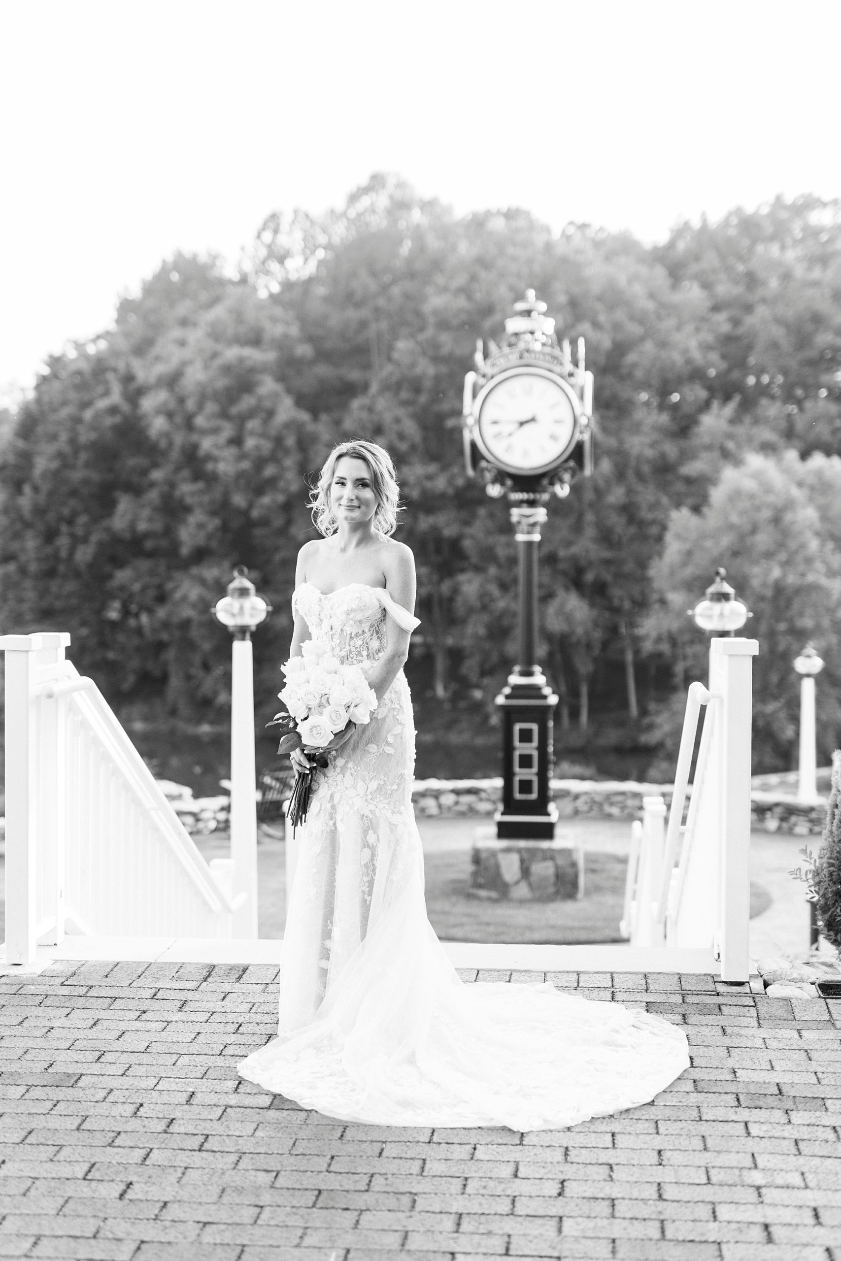 bride stands on brick patio during NC portraits 