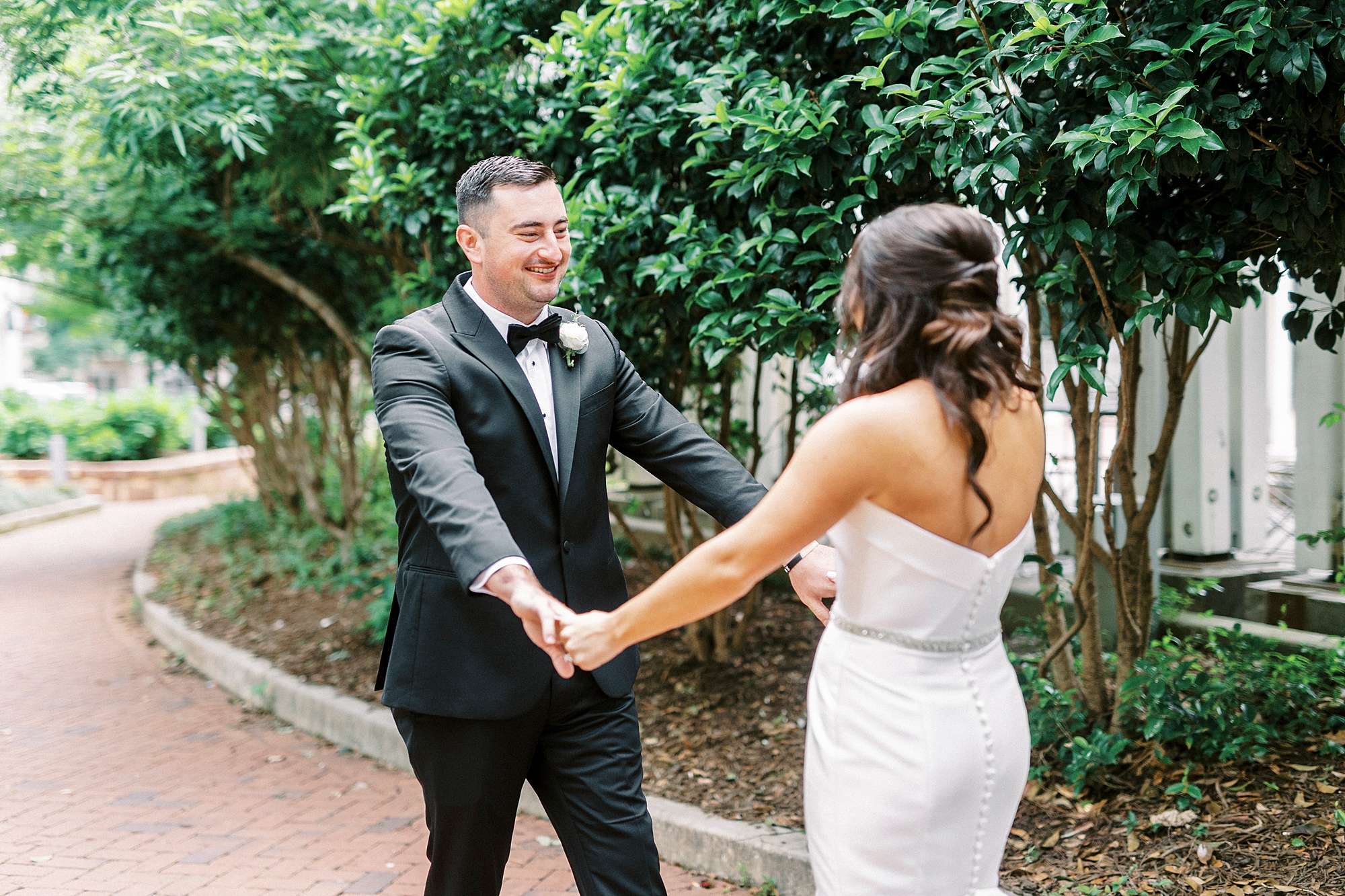 bride and groom have first look in Charlotte NC park