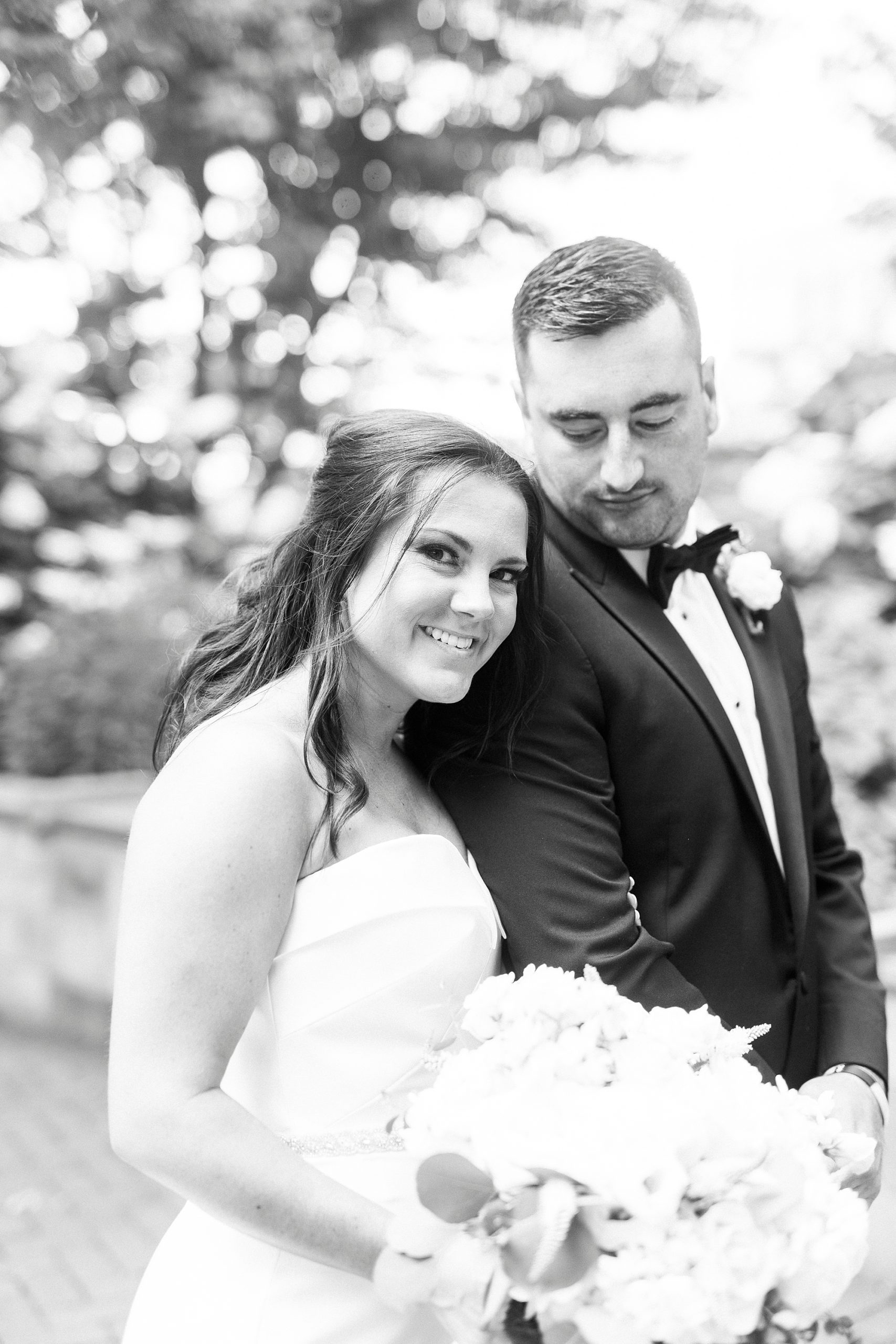 bride leans head on groom's shoulder in Charlotte NC