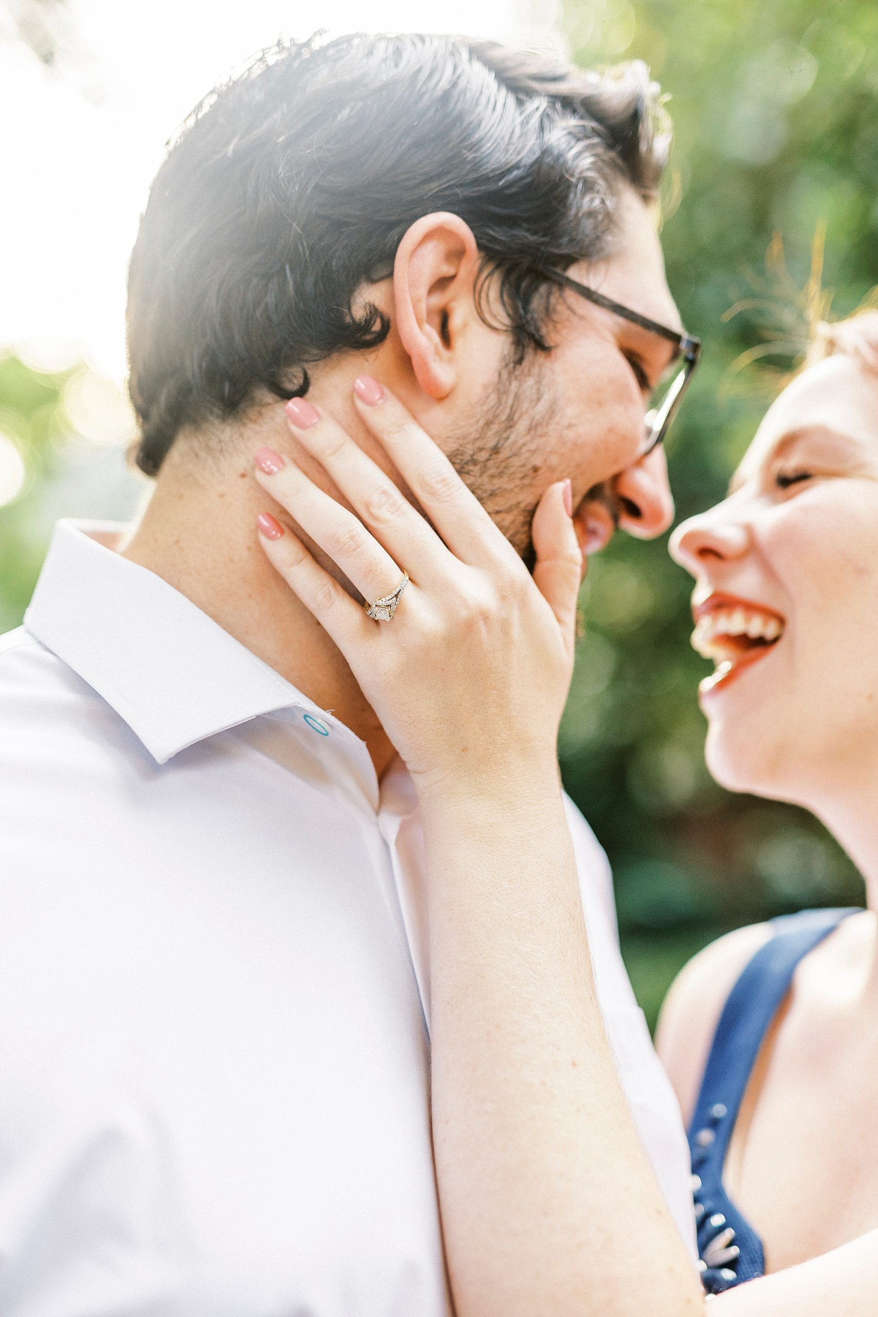 couple laughs together during Wing Haven Garden anniversary session