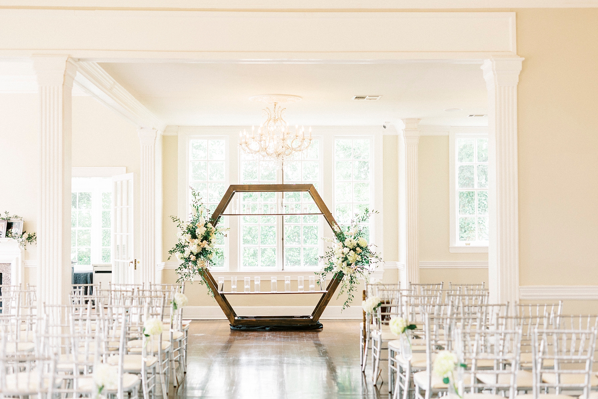 indoor ceremony with hexagon shaped alter at Separk Mansion