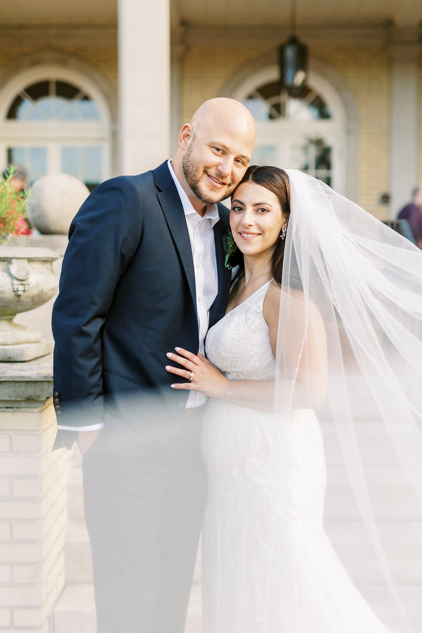 newlyweds hug with veil around them at Separk Mansion