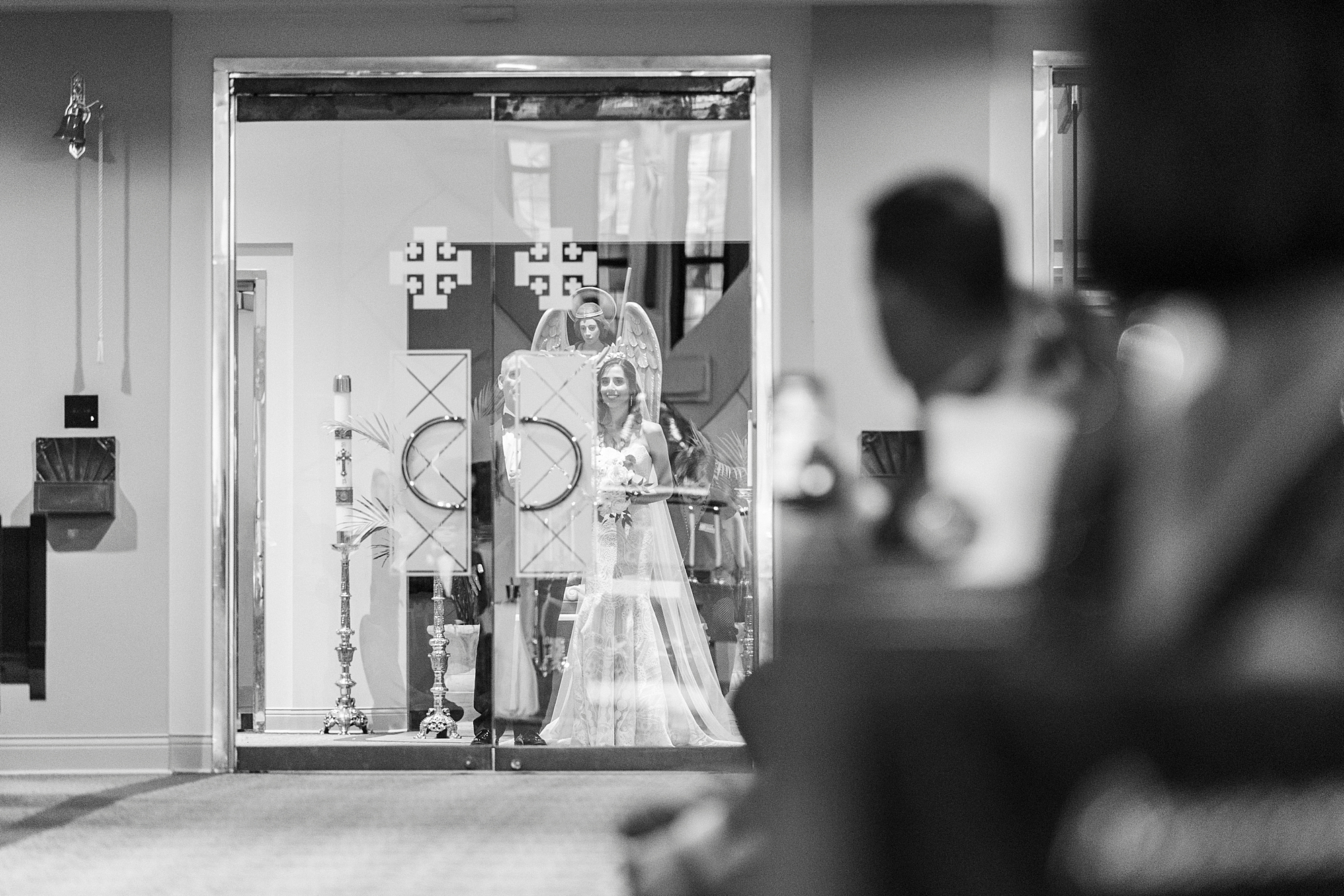 bride waits to walk down aisle at St. Gabriel Catholic Church