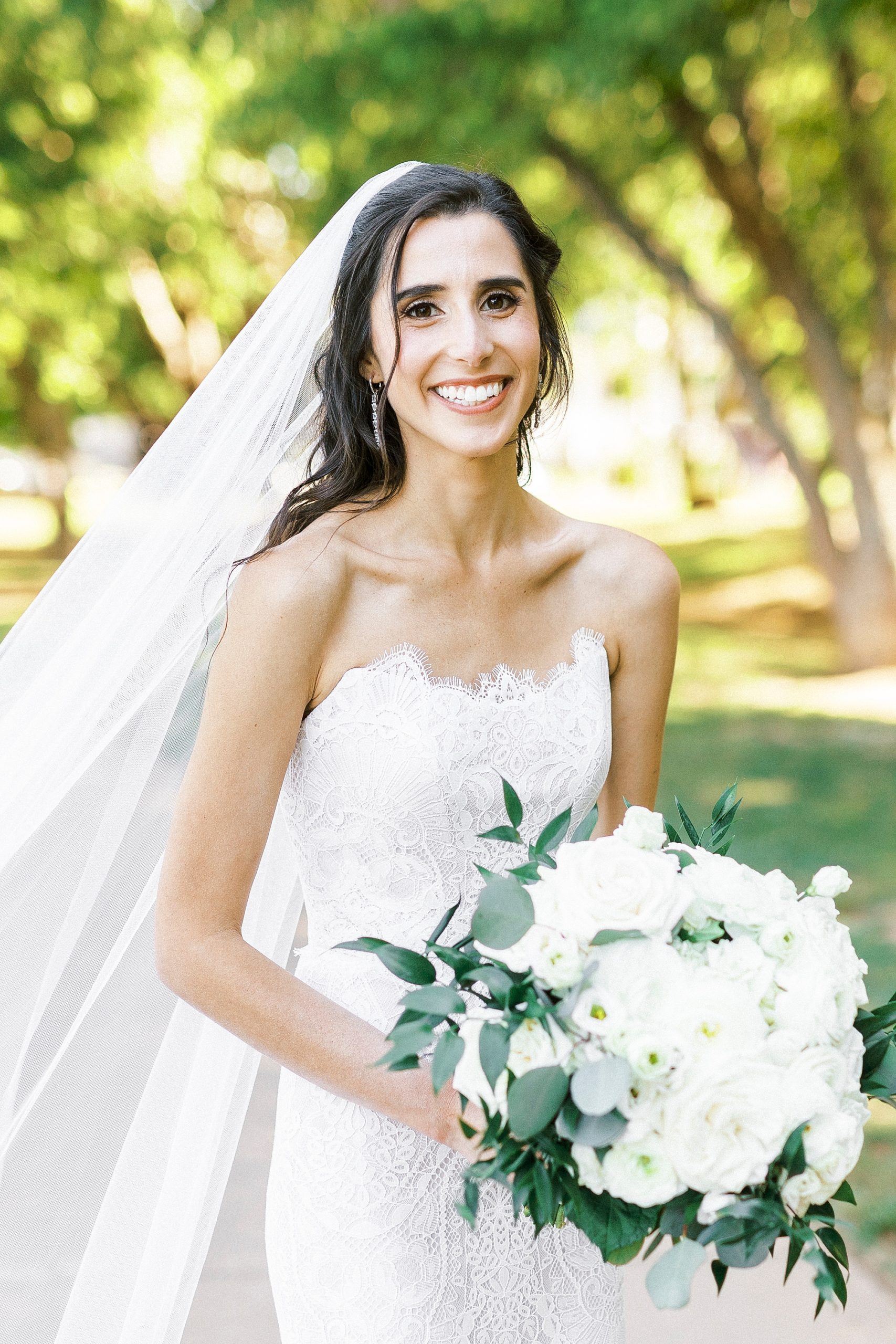 bride smiles during portraits in Freedom Park