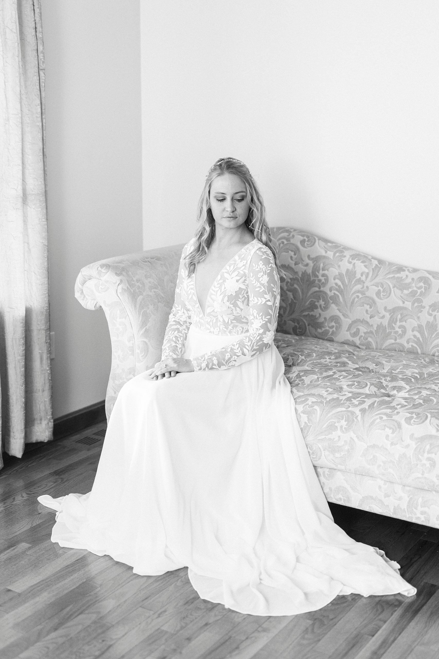 bride sits on couch in home in Lenoir NC