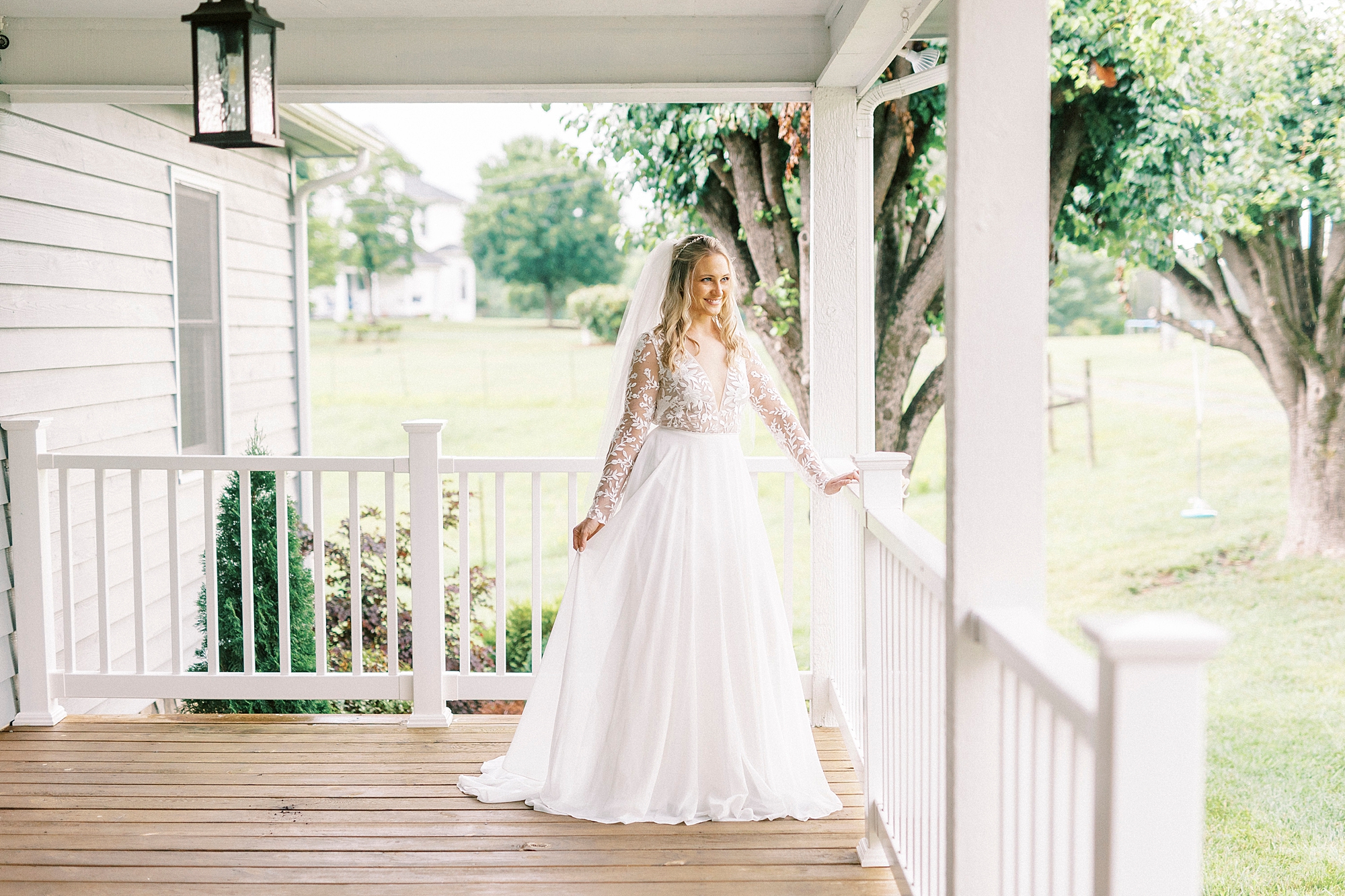 bride poses on porch in Lenoir NC