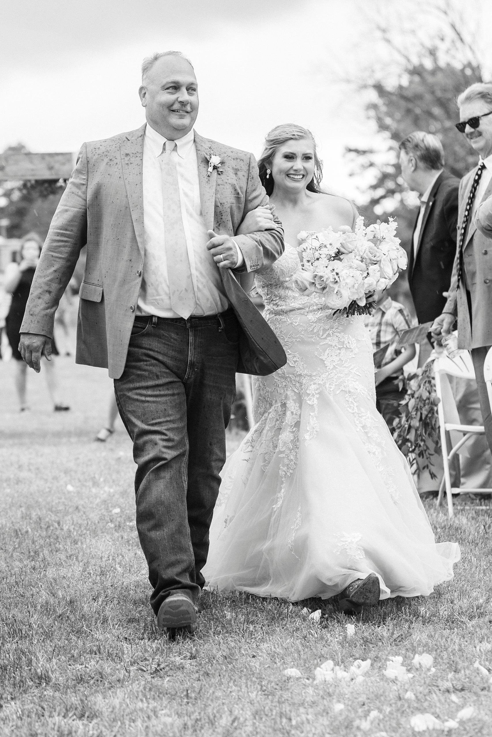 bride walks with dad down aisle