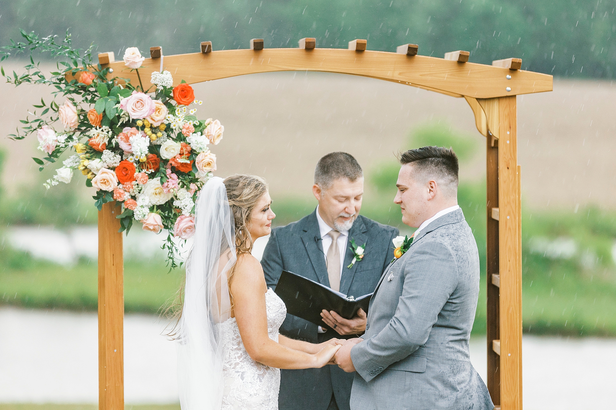 rainy wedding ceremony at The Stable at Riverview