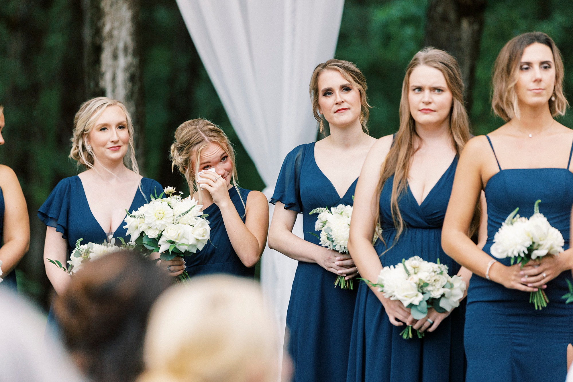 bridesmaid cries during NC wedding ceremony at Boxwood Estate