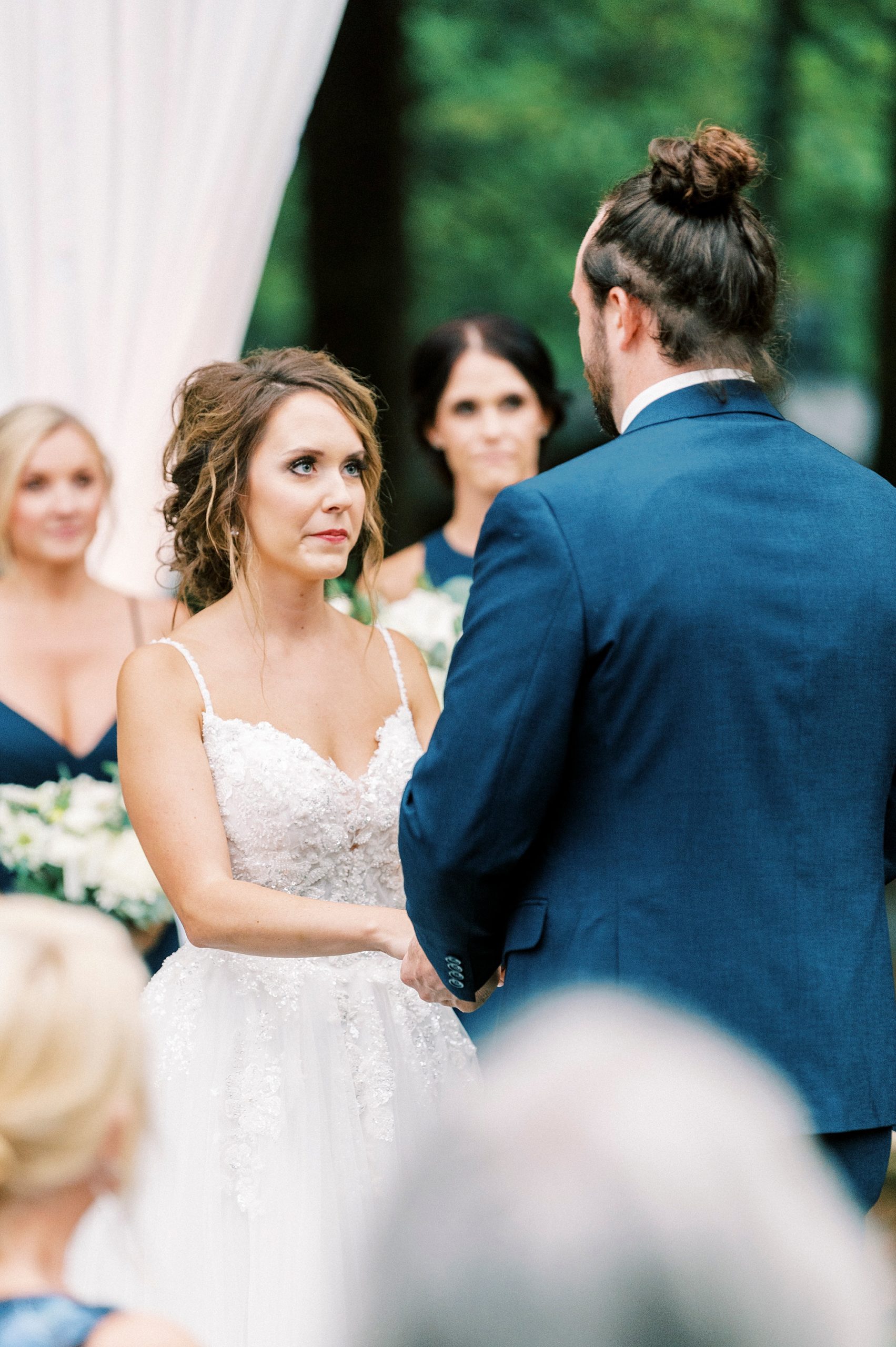 bride looks at groom during vow exchange 