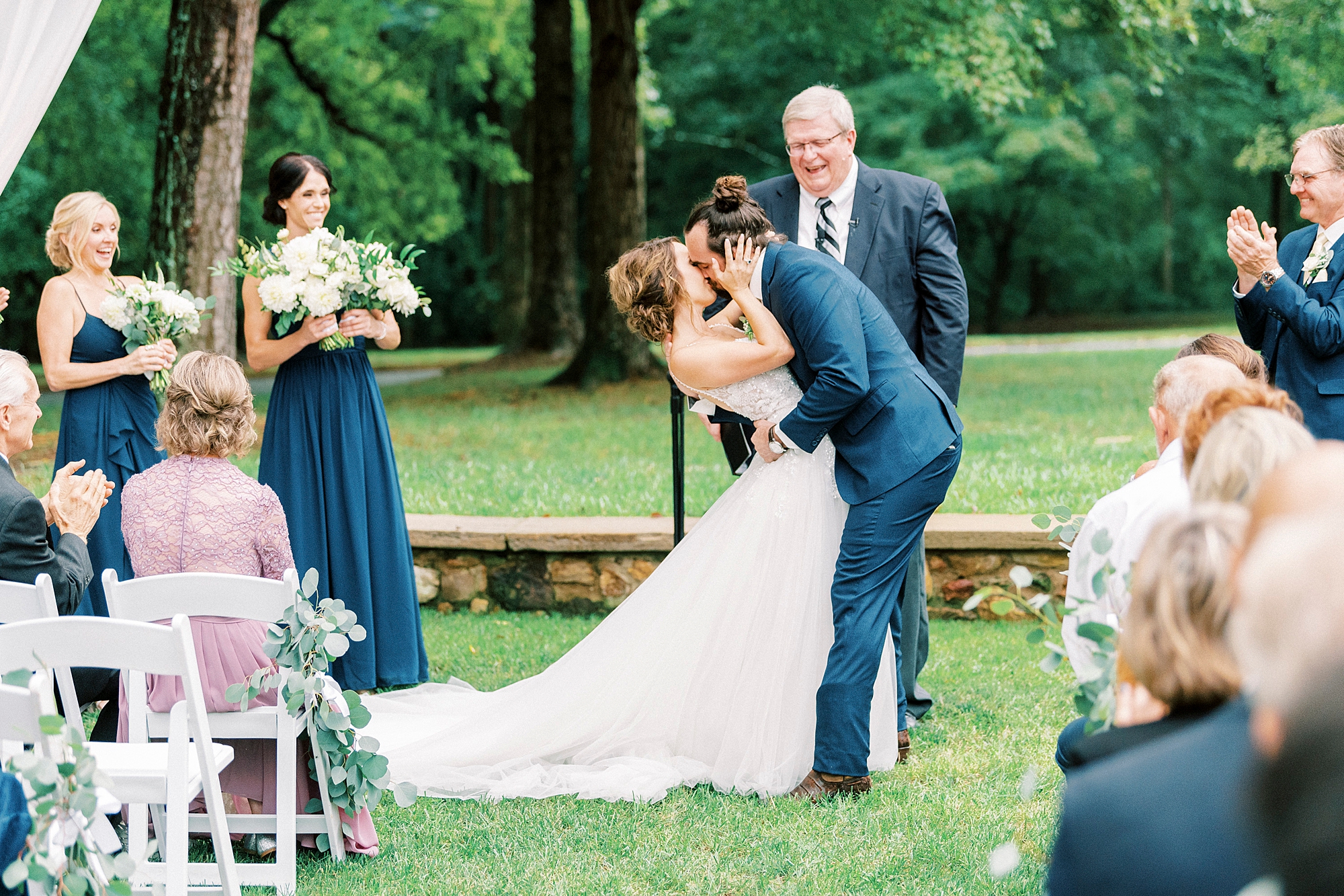 groom kiss bride dipping her at Boxwood Estate