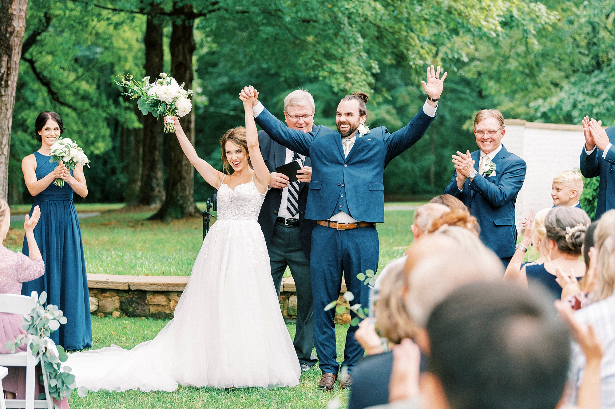 newlyweds cheer leaving ceremony at Boxwood Estate