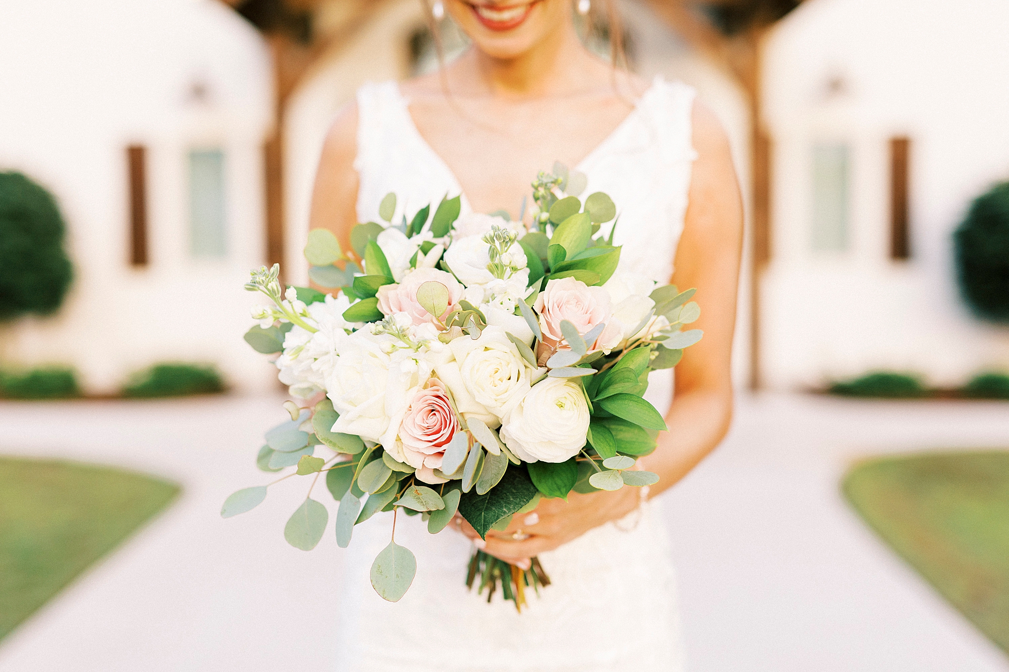 bride holds bouquet of pink and white flowers in Troutman NC