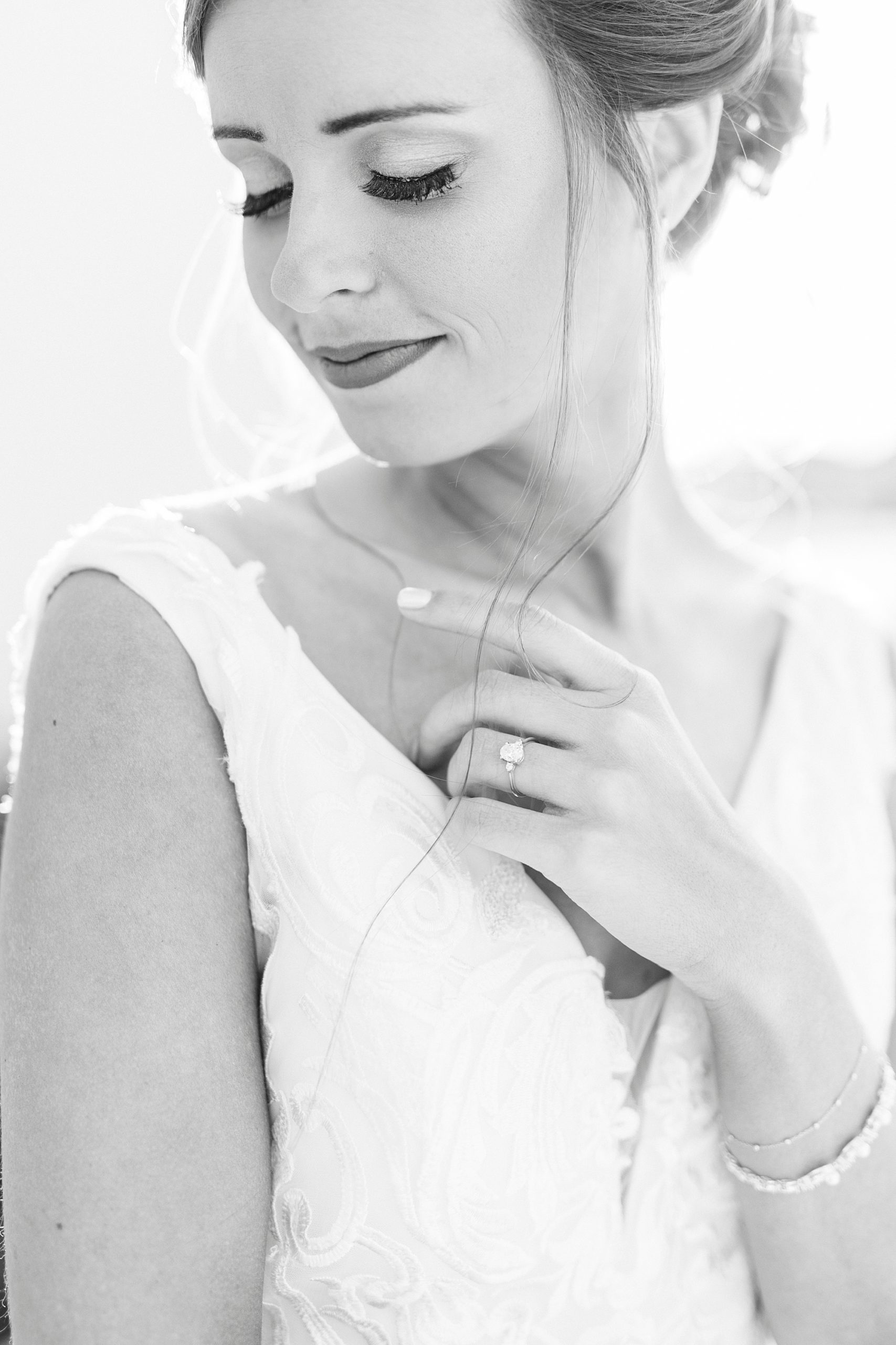 black and white portrait of bride looking over shoulder at Chickadee Hill Farms