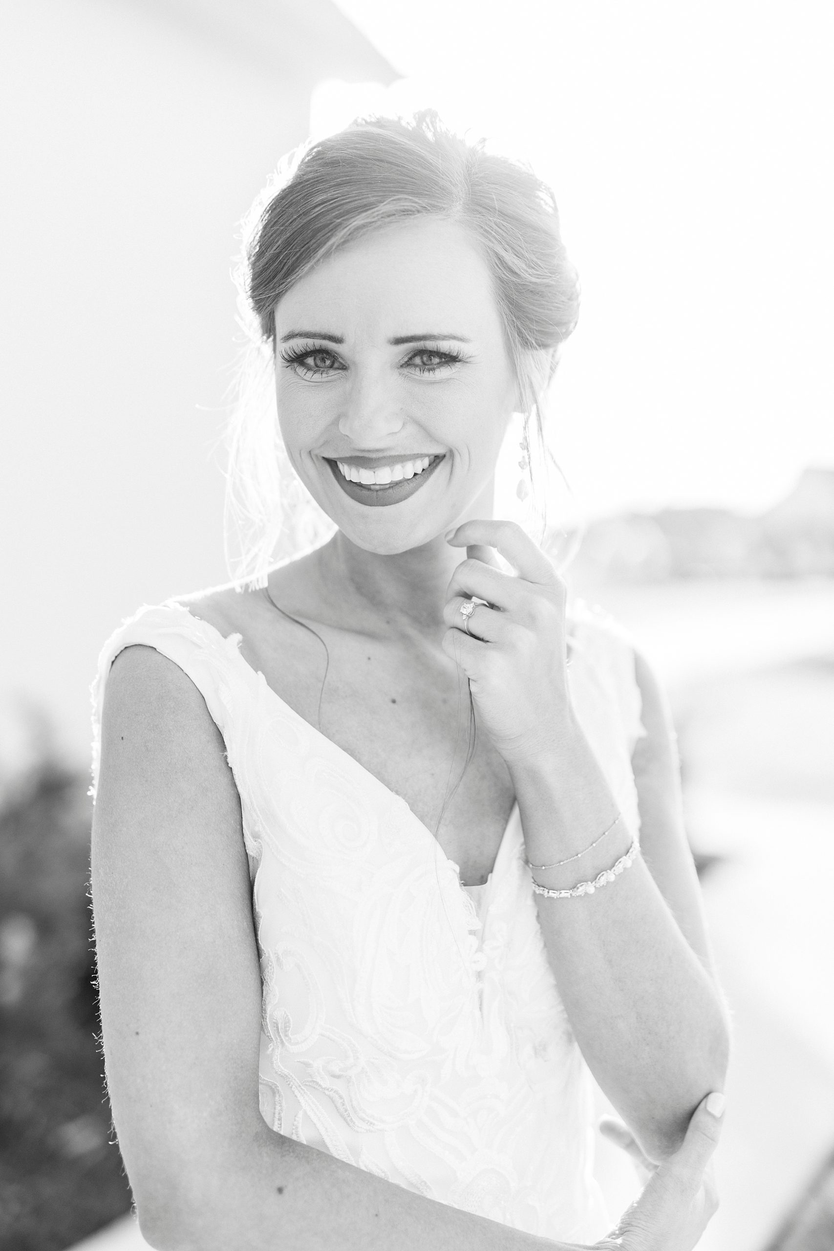 black and white portrait of bride with hands under chin
