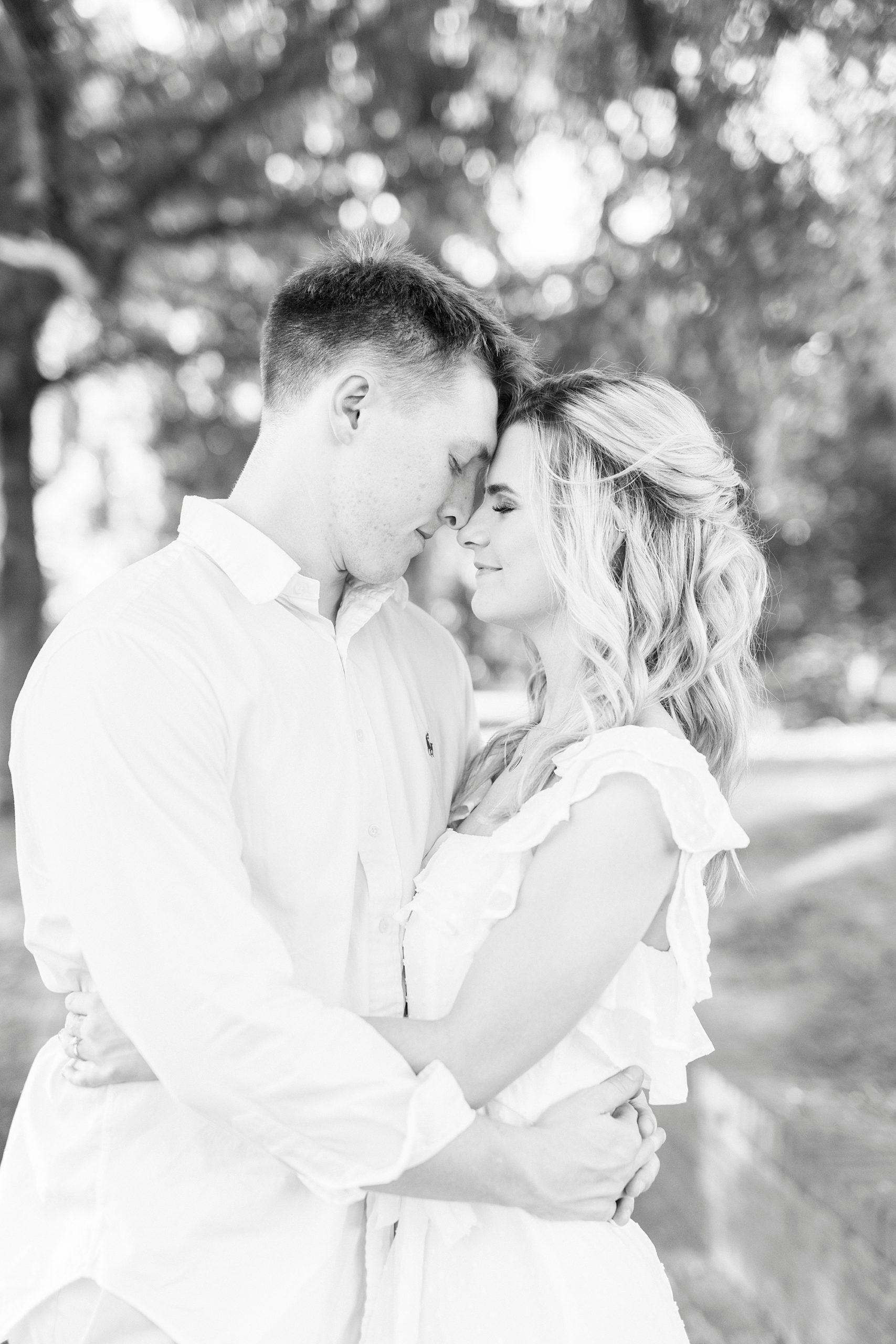 black and white portrait of couple hugging during Downtown Concord engagement portraits