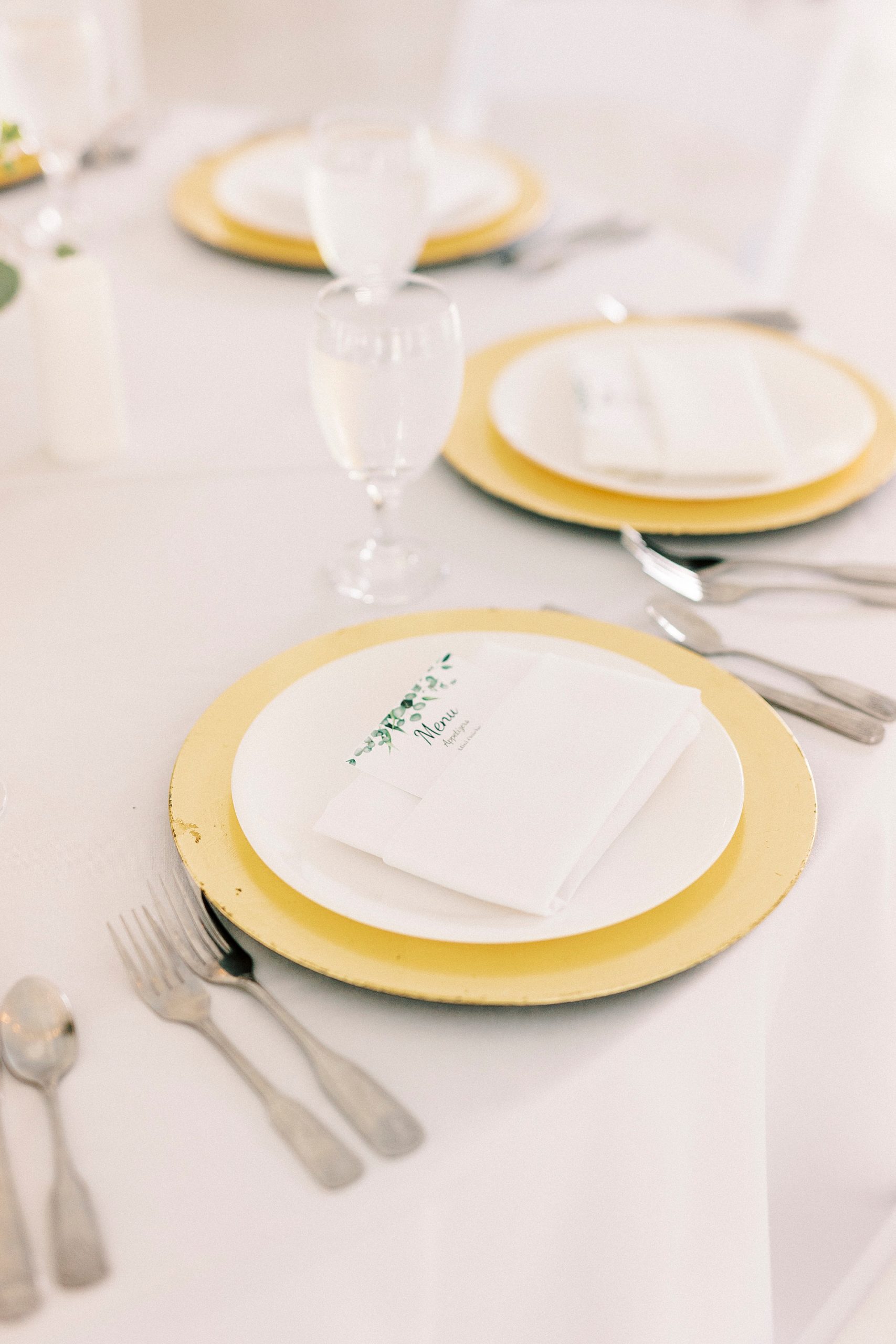 place settings with gold and white details at Chetola Resort