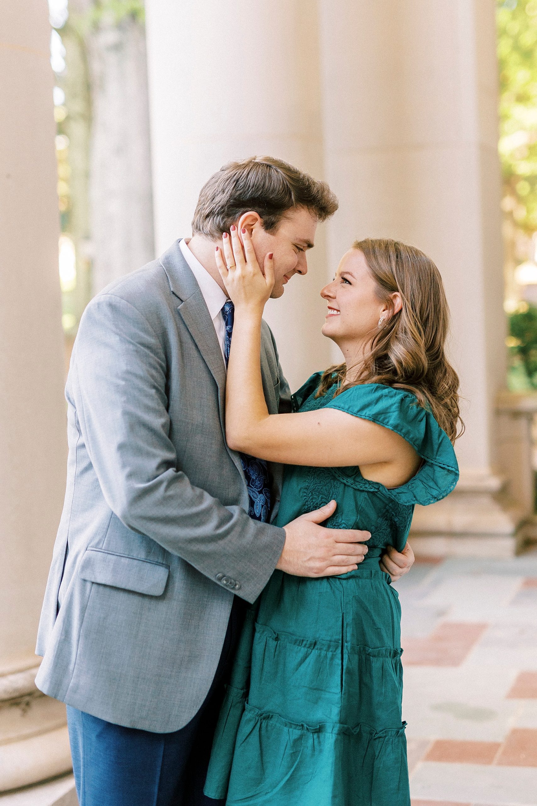bride and groom smile together during Downtown Davidson engagement session