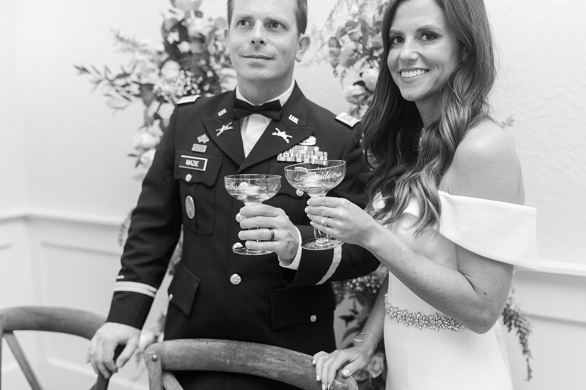 bride and groom toast with champagne during Lake Norman wedding reception