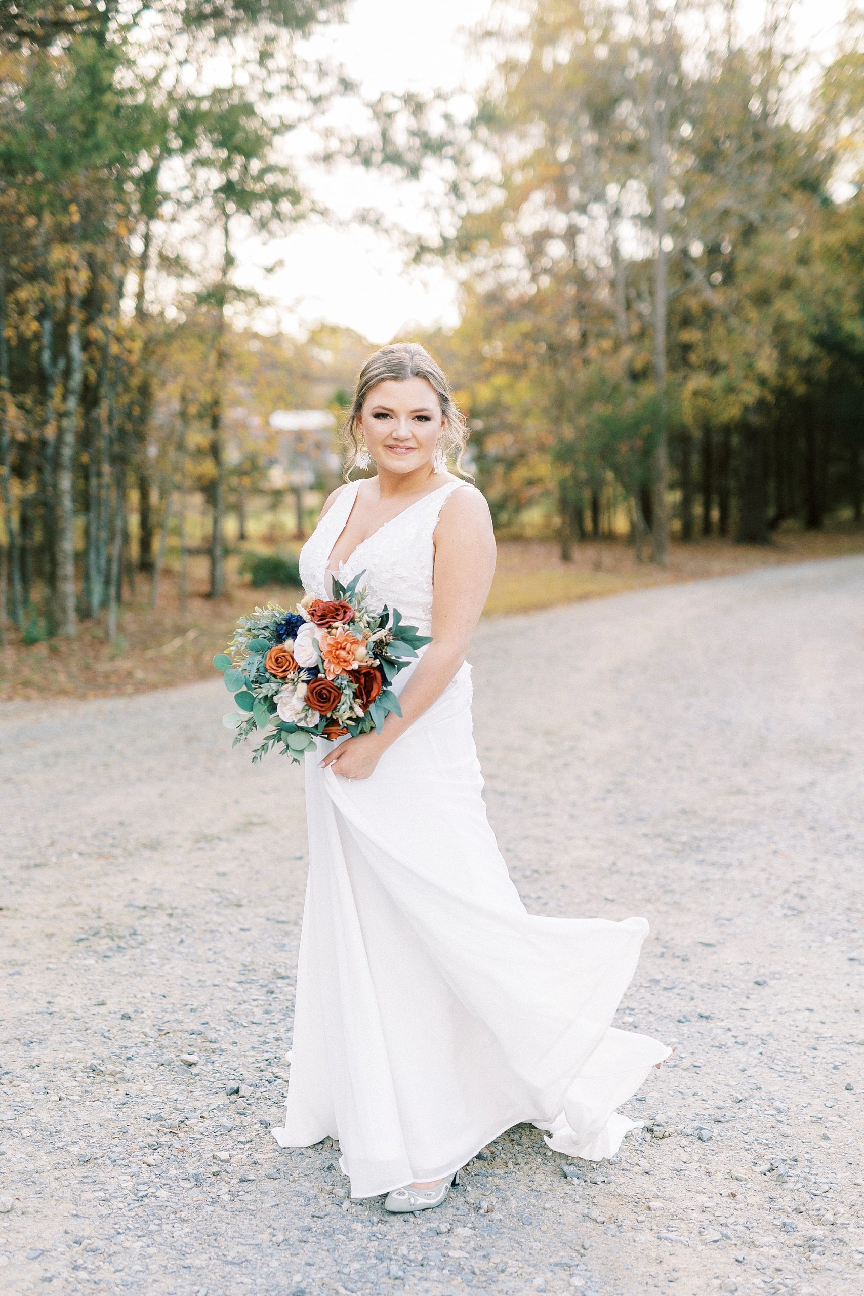 bride twirls wedding gown on walkway at Bella Terra 