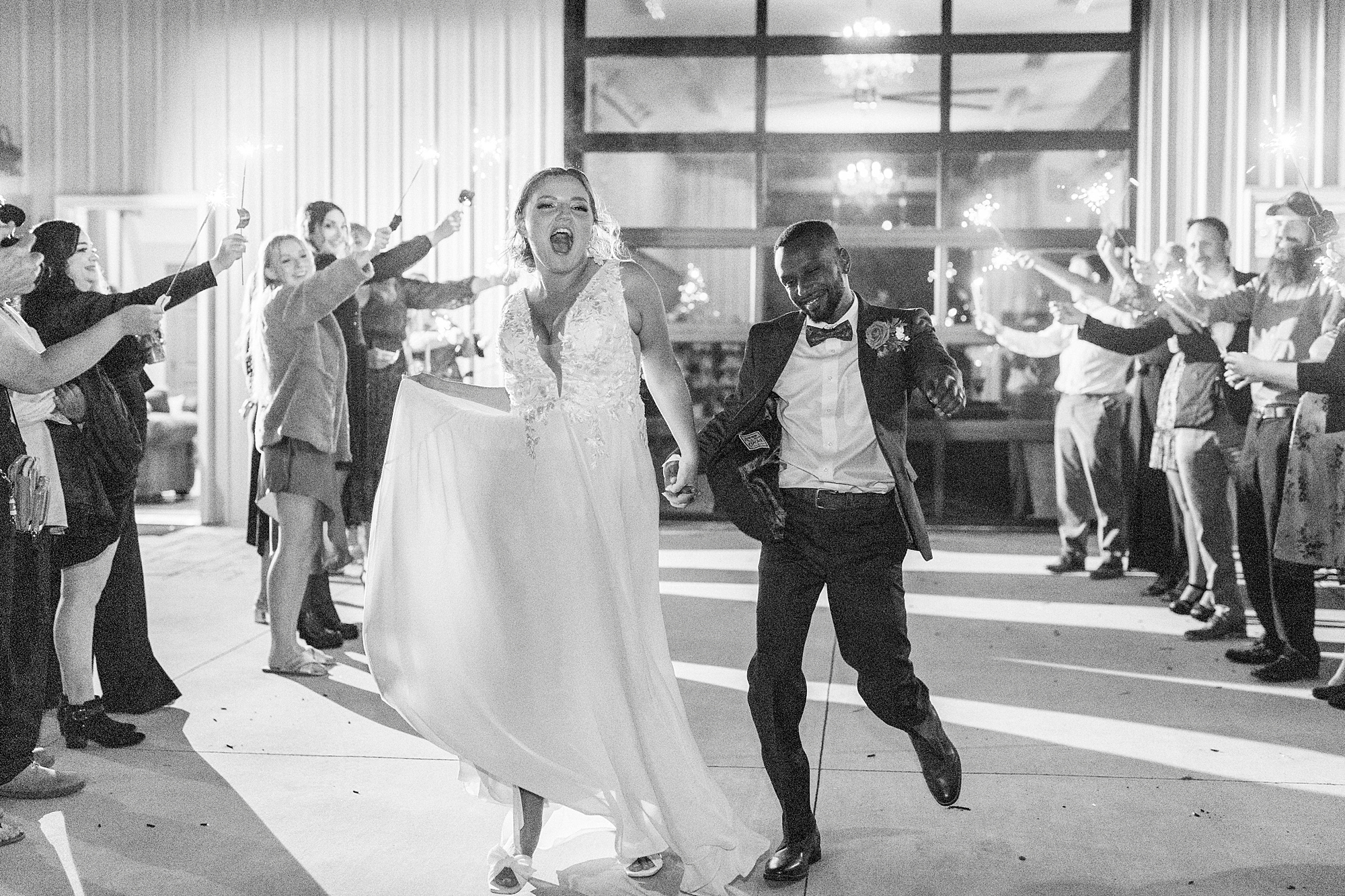 bride and groom dance walking through sparkler exit