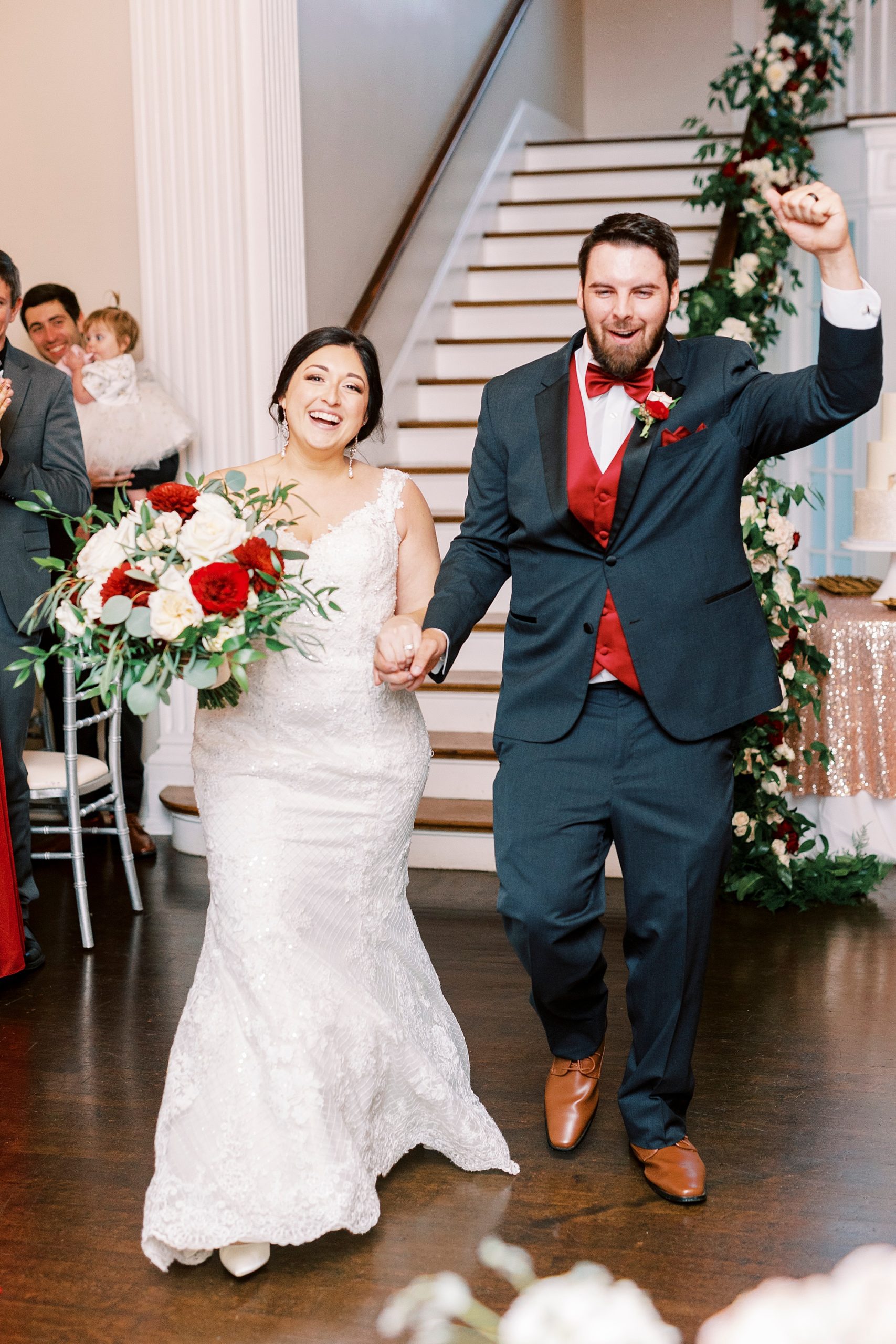 bride and groom cheer during reception entrance at Separk Mansion