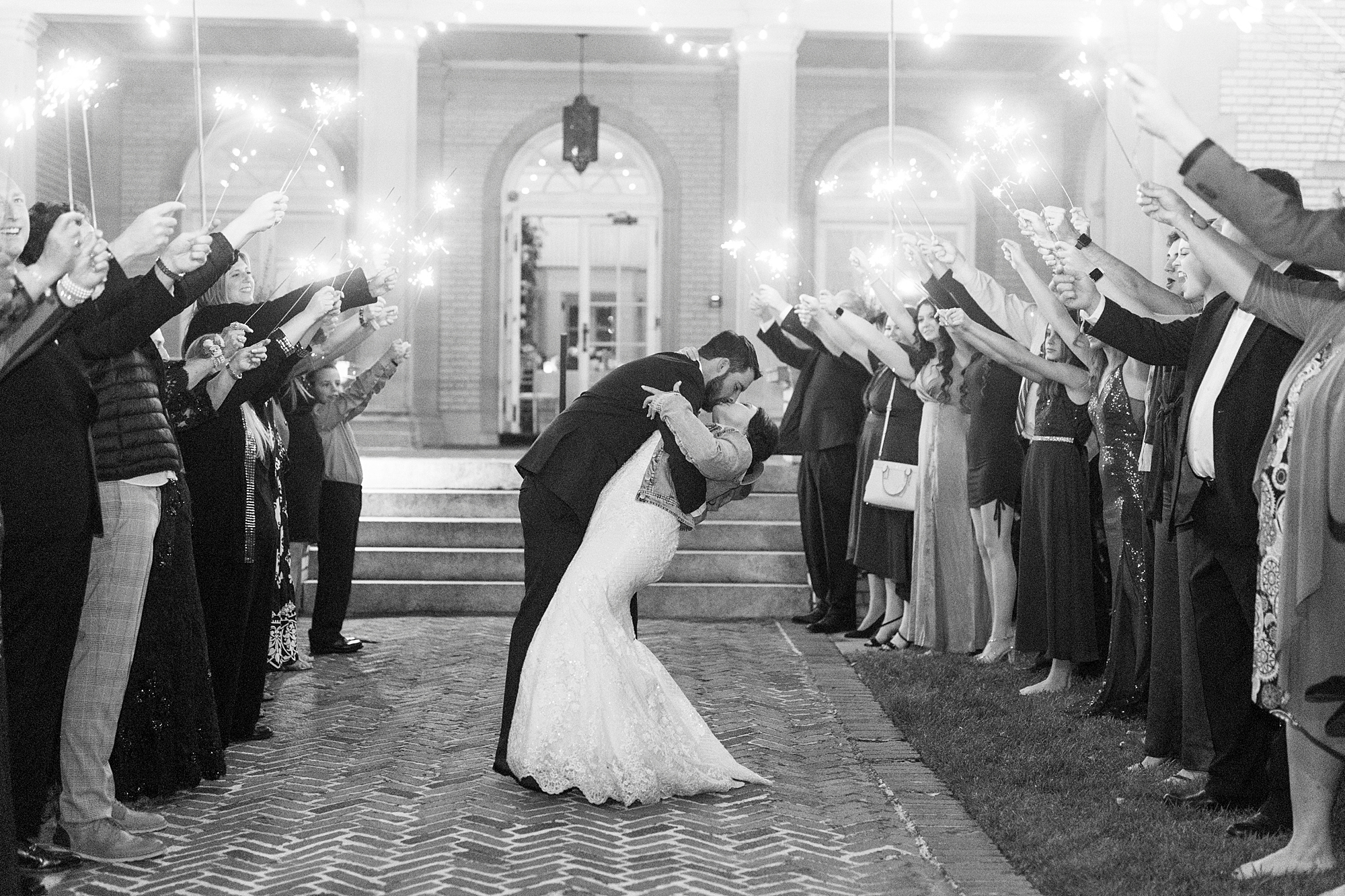 bride and groom kiss during sparkler exit at Separk Mansion