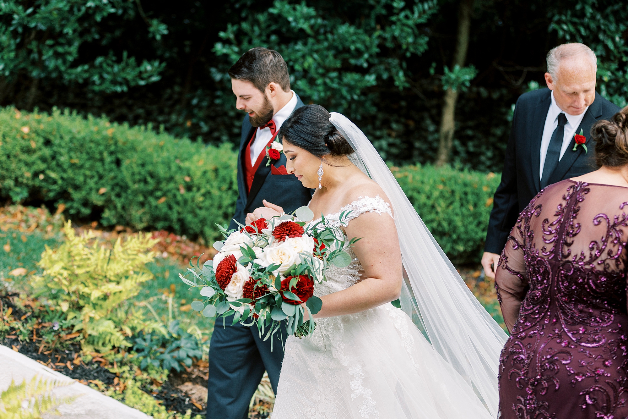 bride and groom walk up steps for outdoor wedding ceremony at Separk Mansion