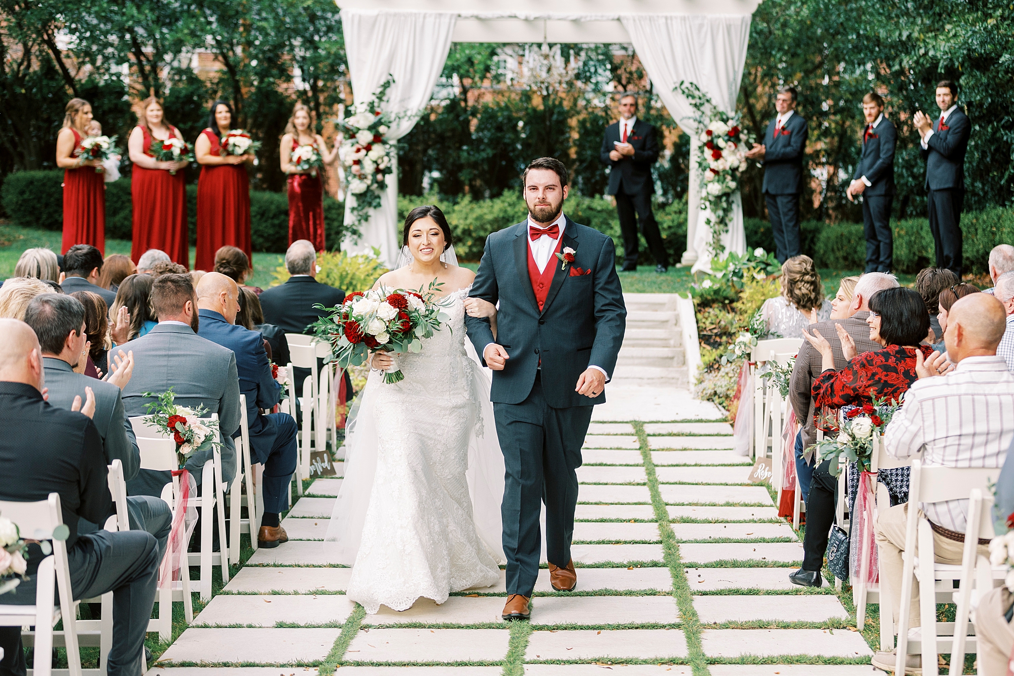bride and groom walk up aisle after outdoor wedding ceremony at Separk Mansion