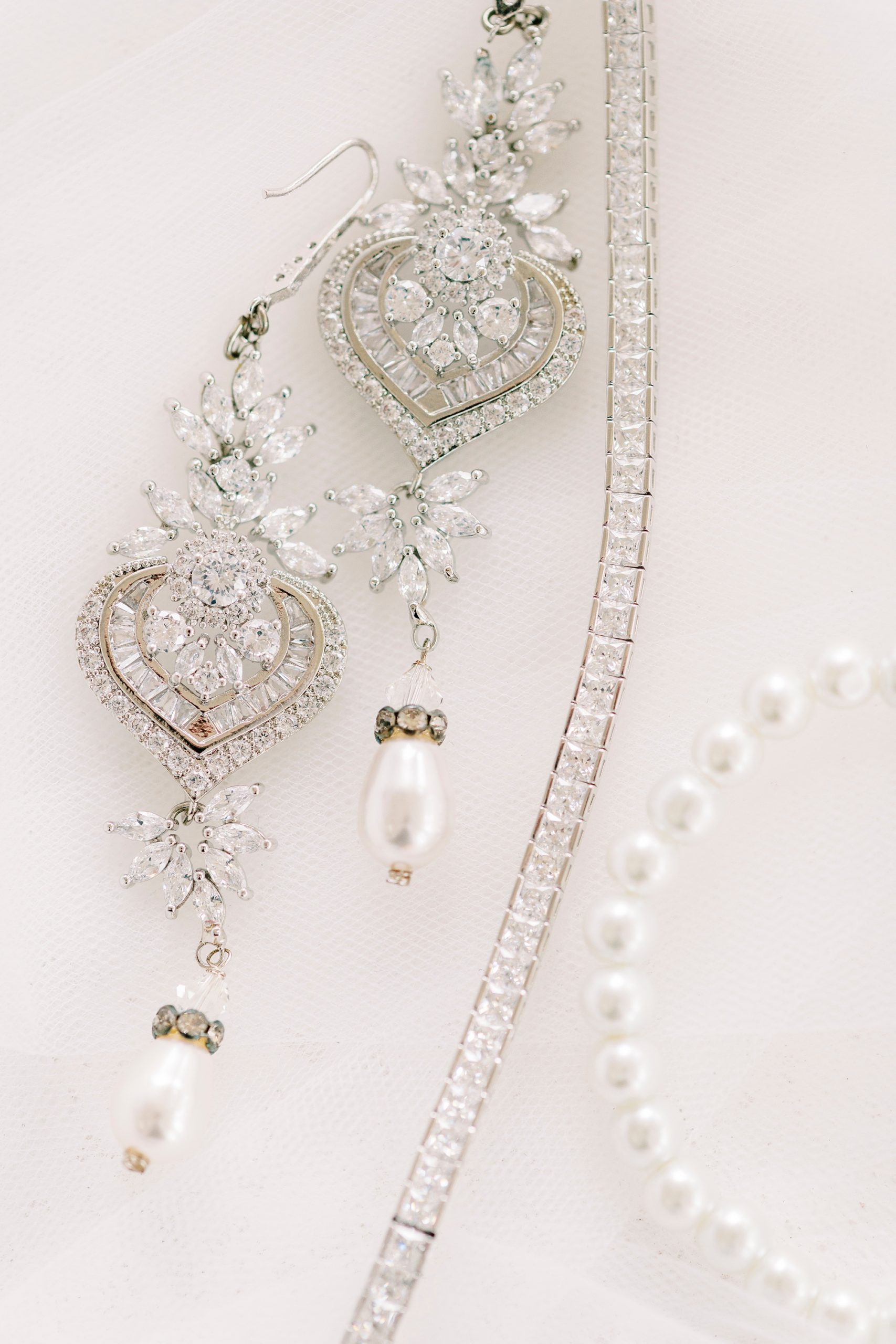 bride's dangling earrings and pearl bracelet for fall wedding at Separk Mansion