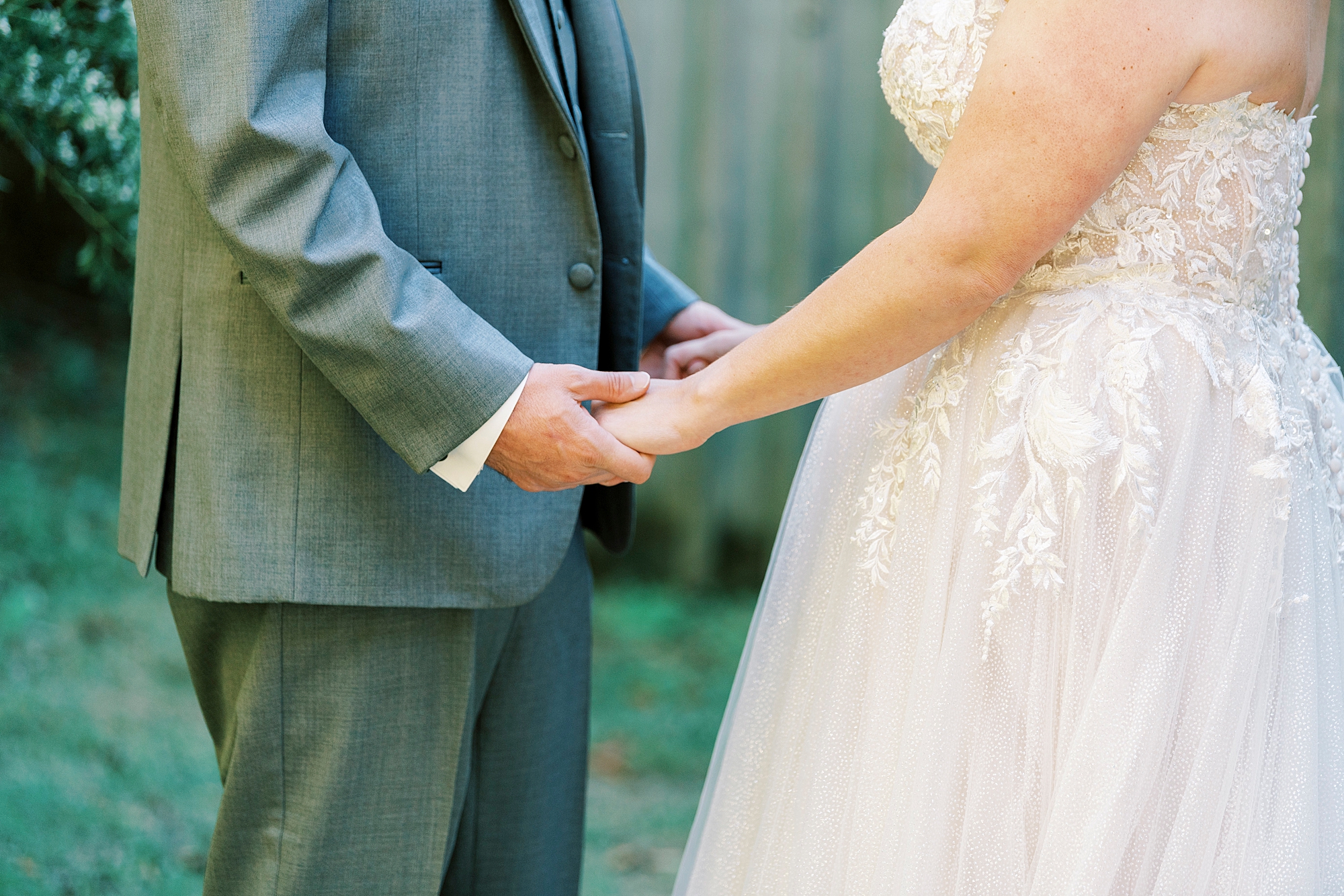bride and groom hold hands during portraits at the Gin at Aw Shucks Farm