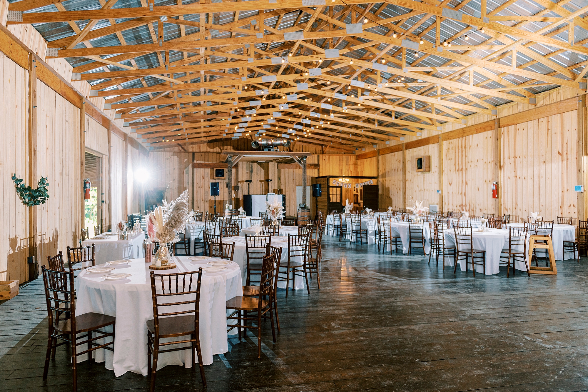 wedding reception in barn at the Gin at Aw Shucks Farm