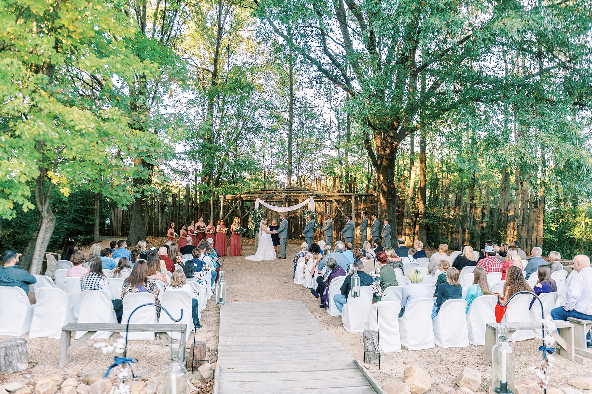 bride and groom exchange vows in outdoor ceremony at the Gin at Aw Shucks Farm