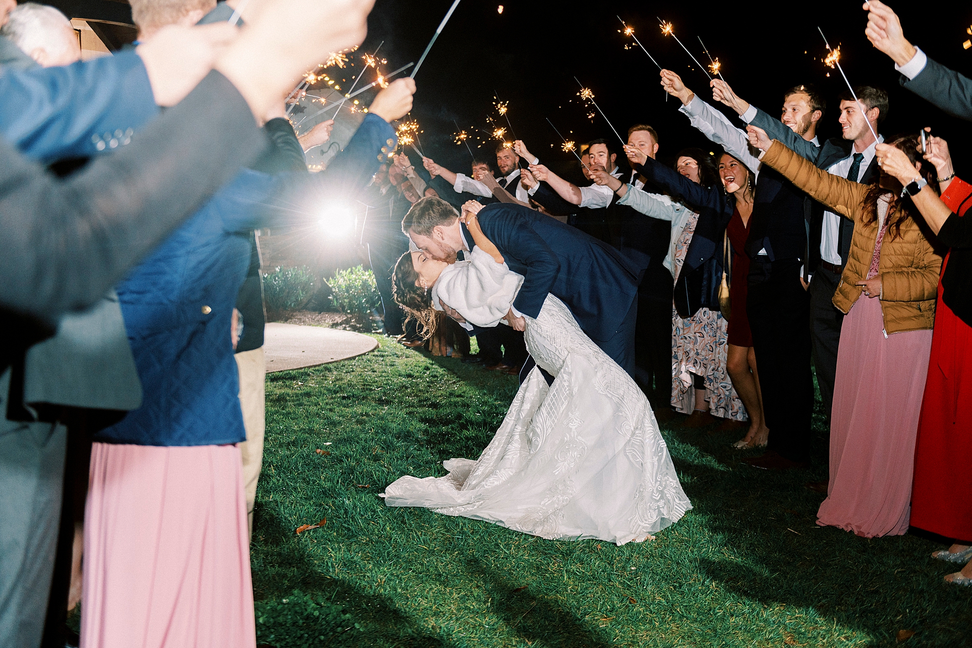 groom dips bride during sparker exit