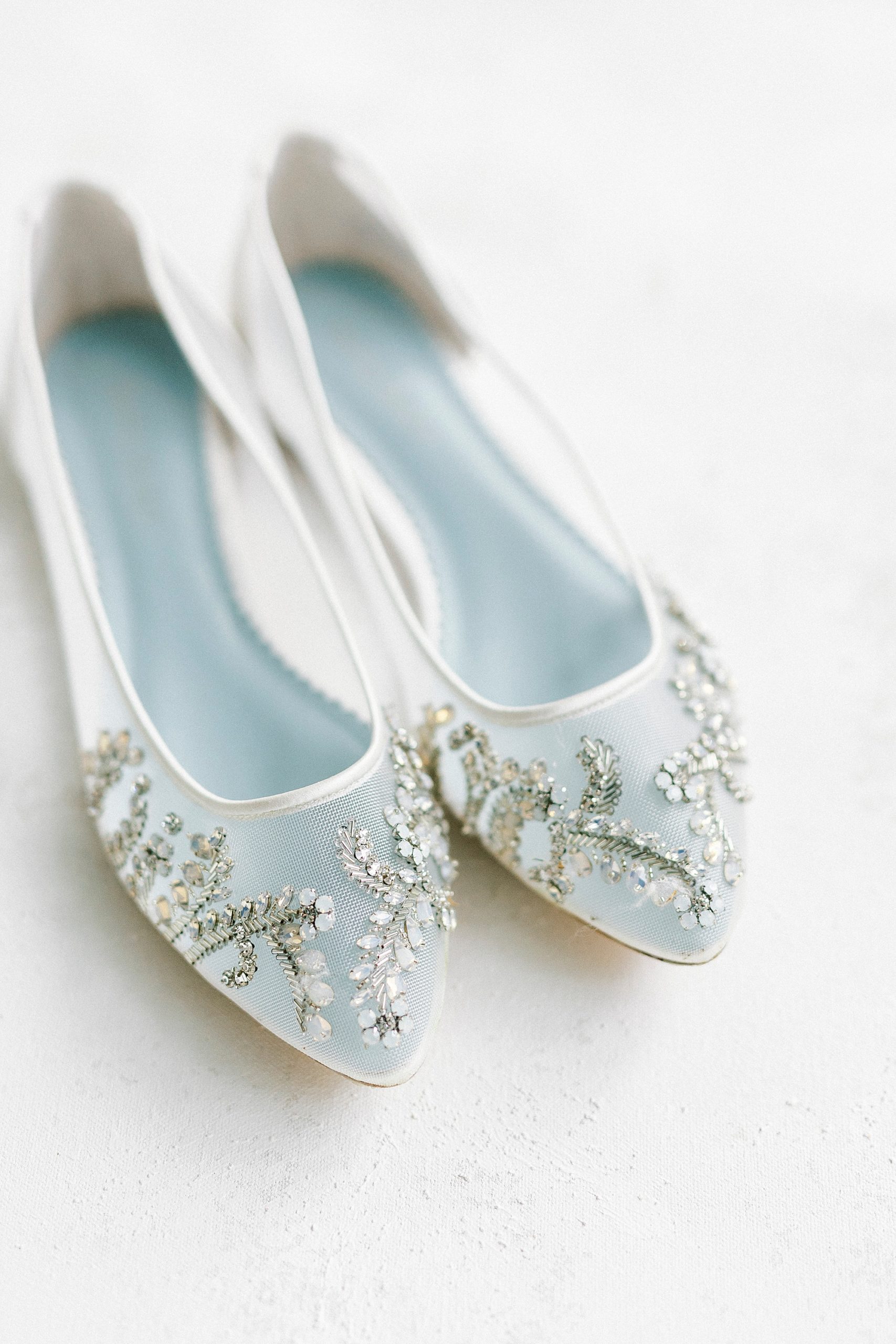white flats with jeweled tops