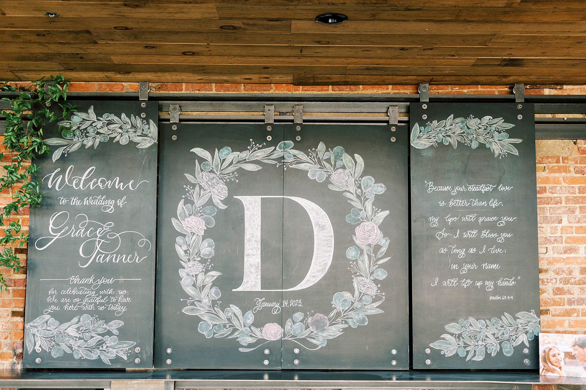 custom monogram and welcome chalk sign at the Cadillac Service Garage 