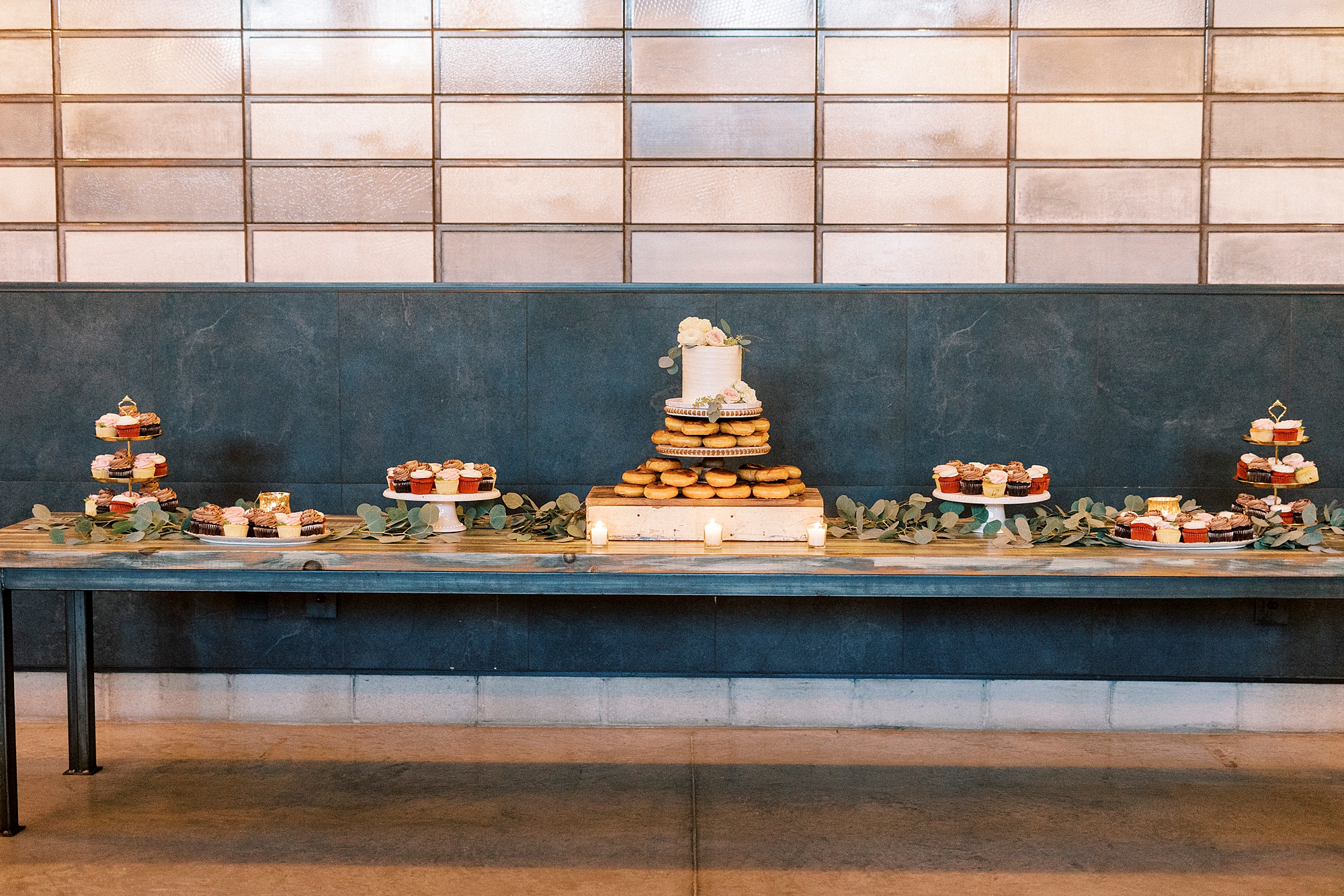 dessert display with cake and donuts at the Cadillac Service Garage