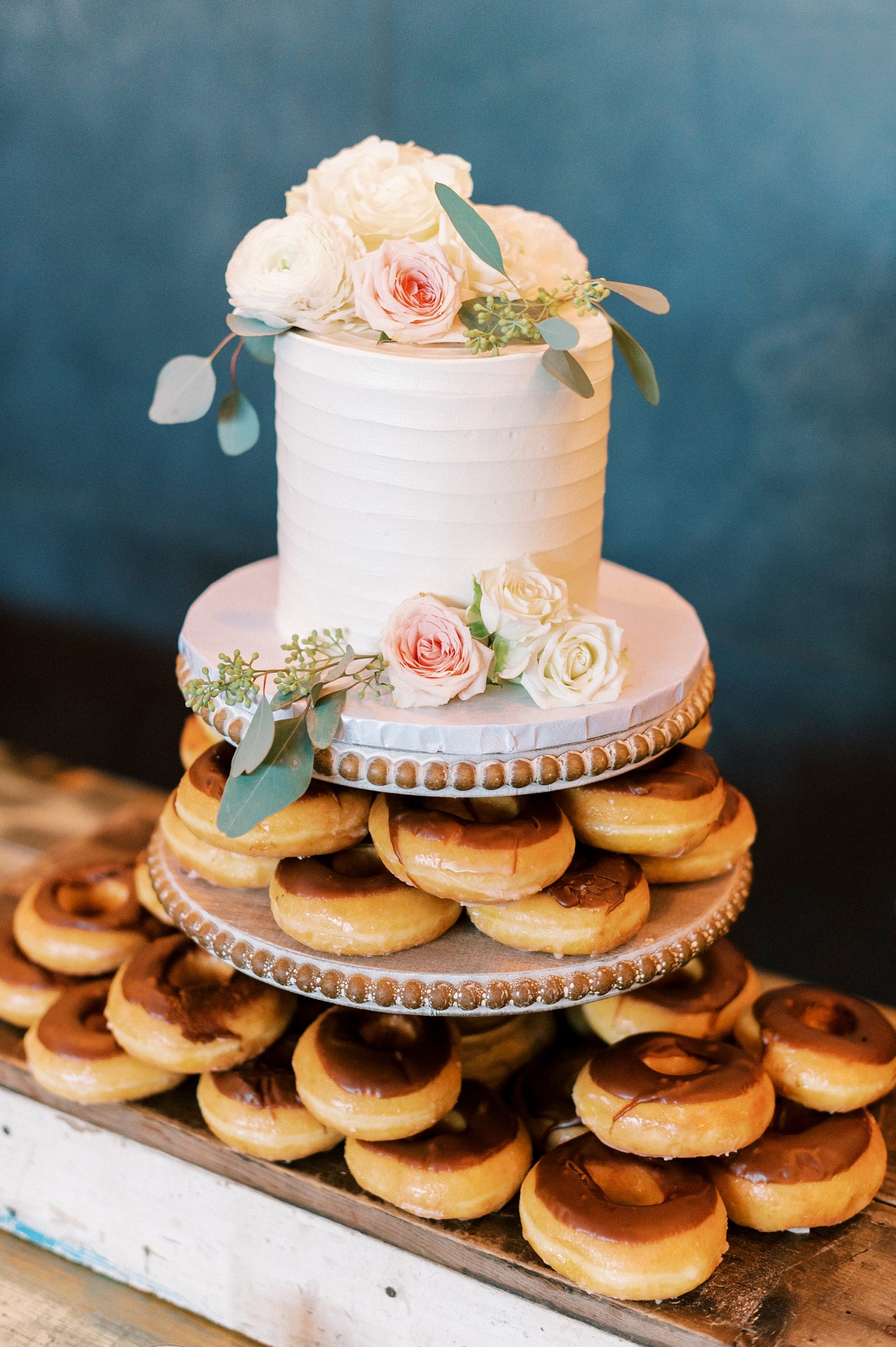 cake topper with donuts underneath for Greensboro NC wedding reception 