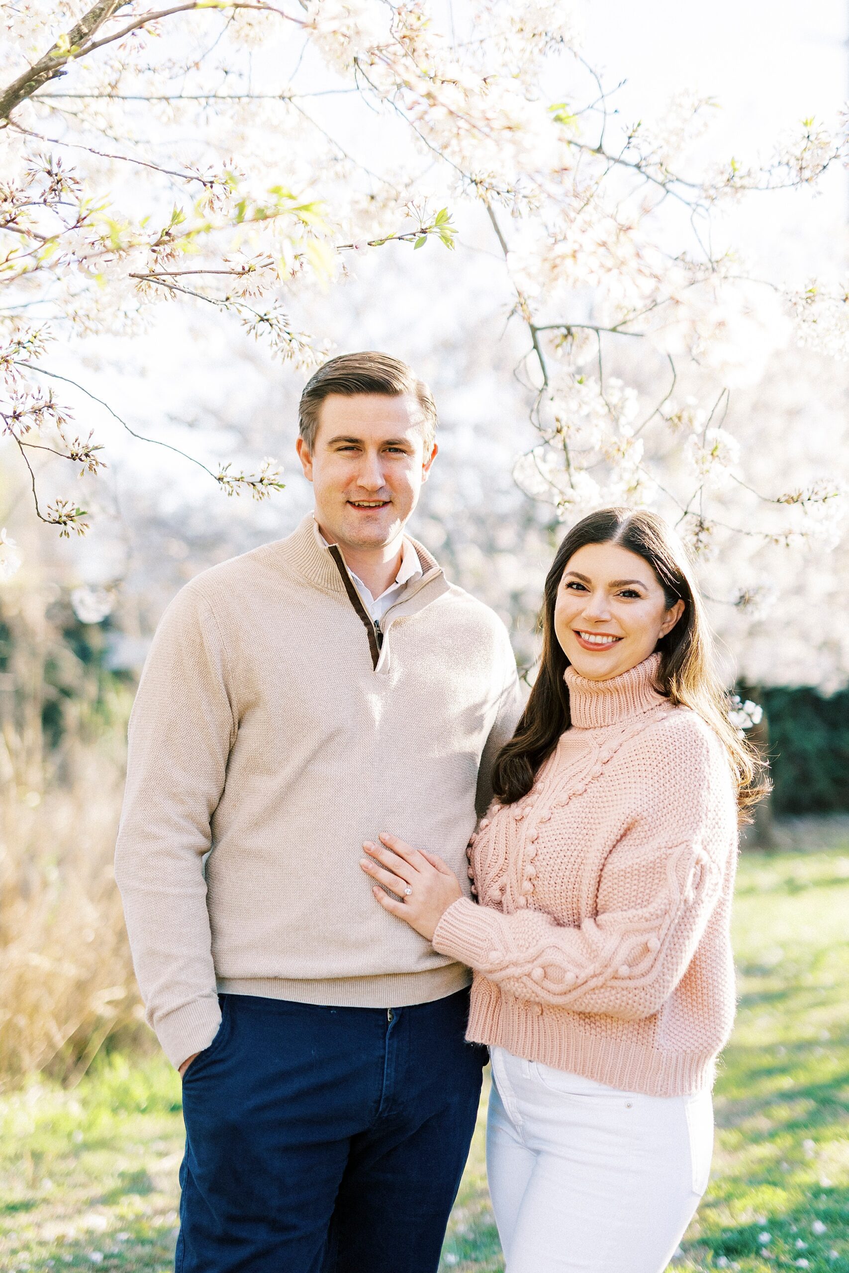 spring engagement portraits by pink tree in Elizabeth Park