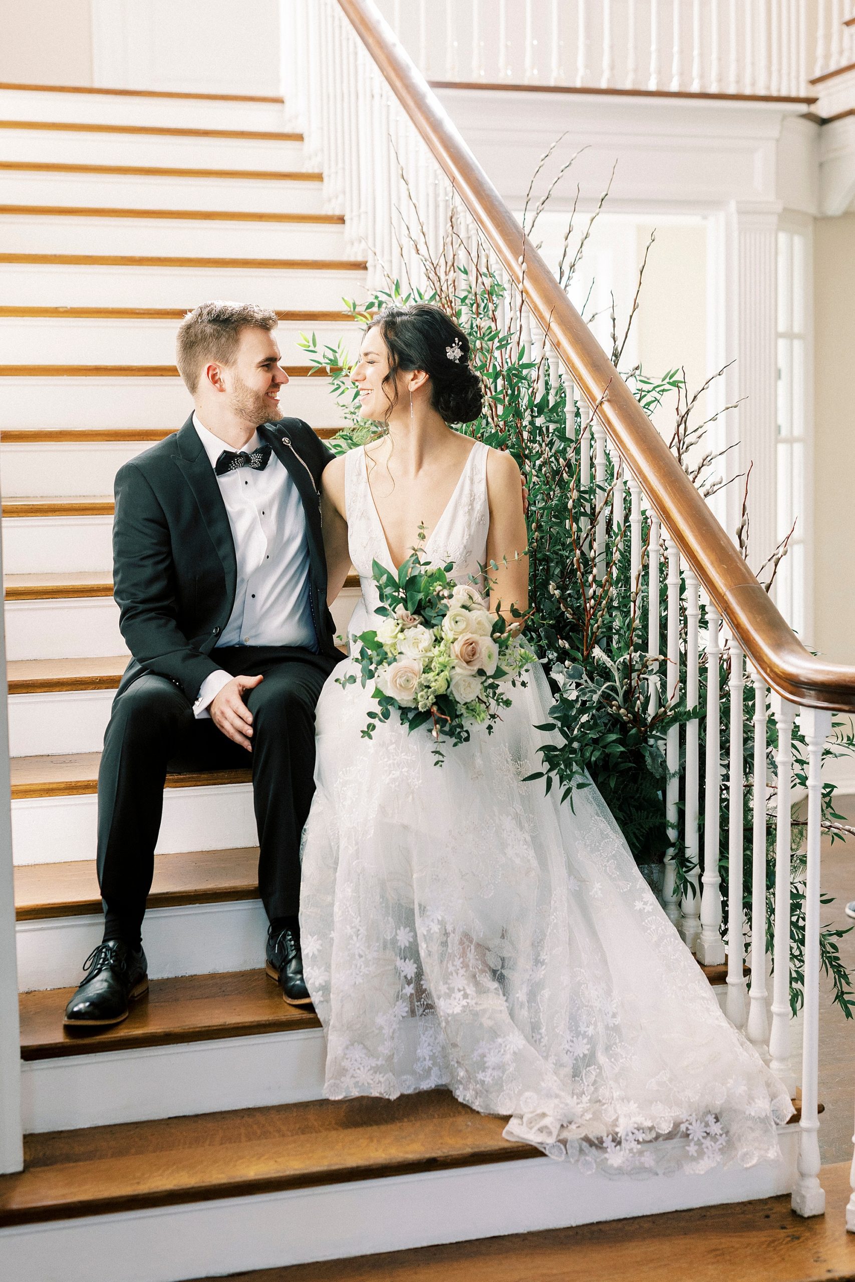 bride and groom smile together on steps at Separk Mansion