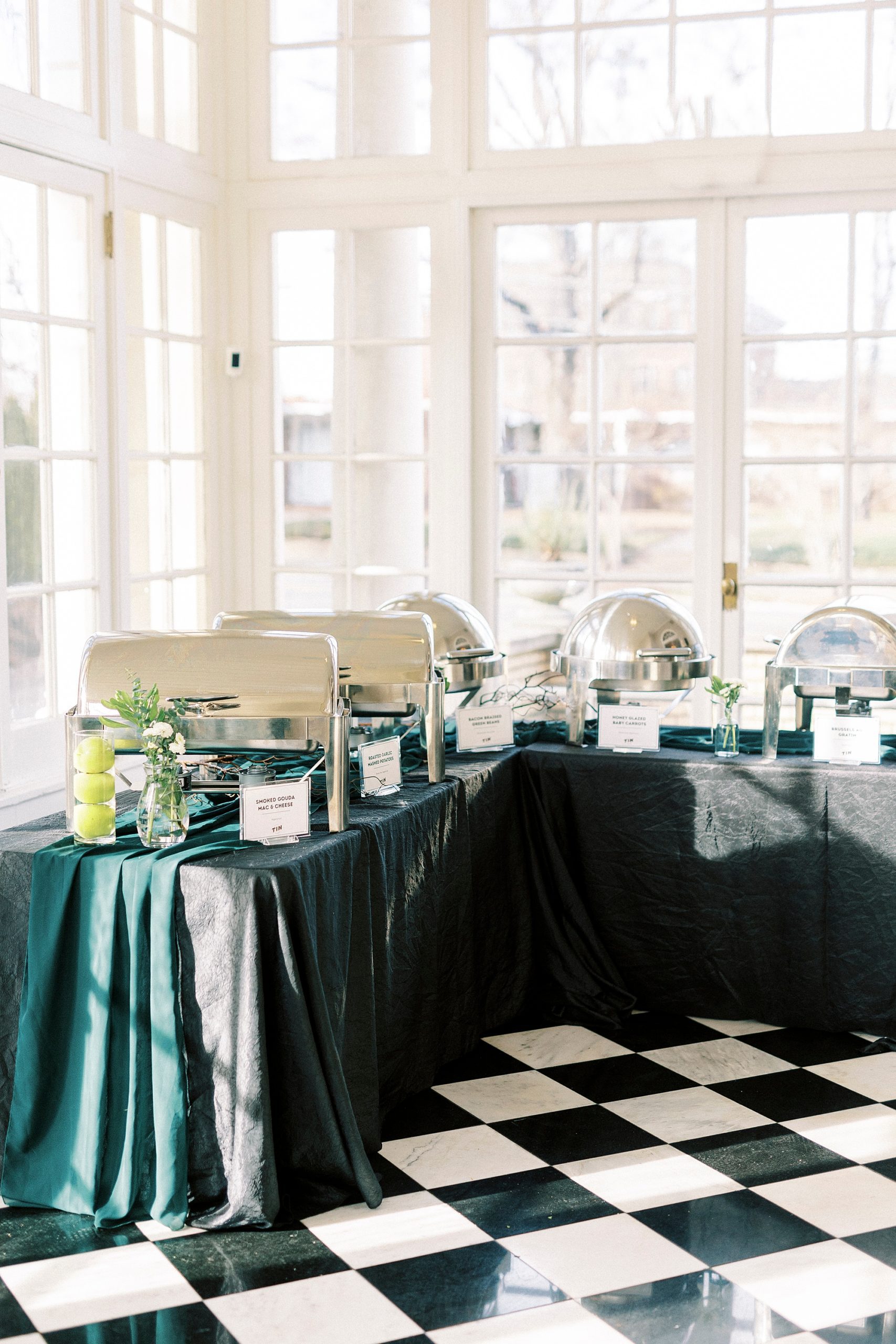 buffet on table with black and green table cloth for Grand Tasting Event at Separk Mansion in winter 2023 