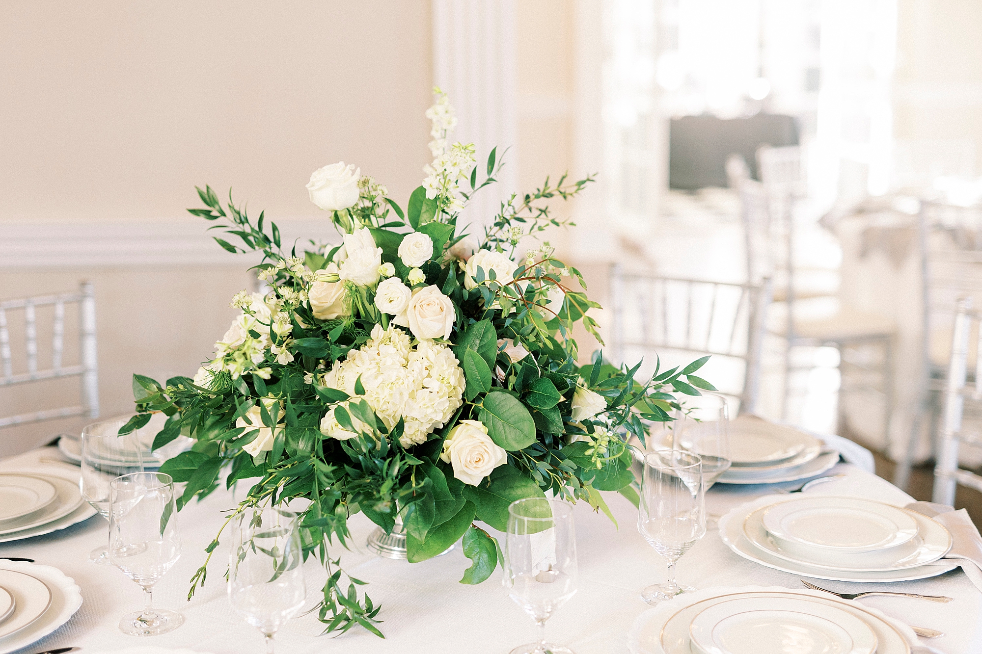 white rose centerpiece for Grand Tasting Event at Separk Mansion in winter 2023 