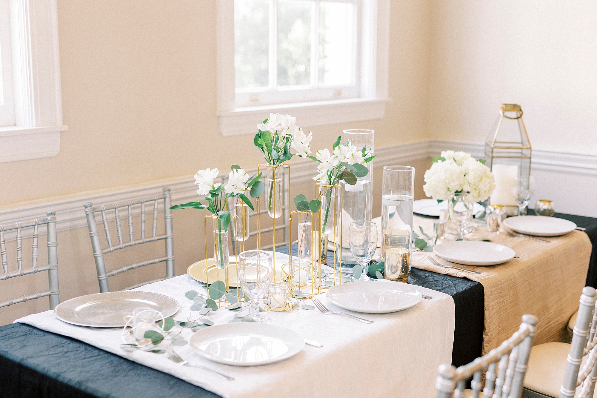 family style seating for wedding reception with white and gold details 